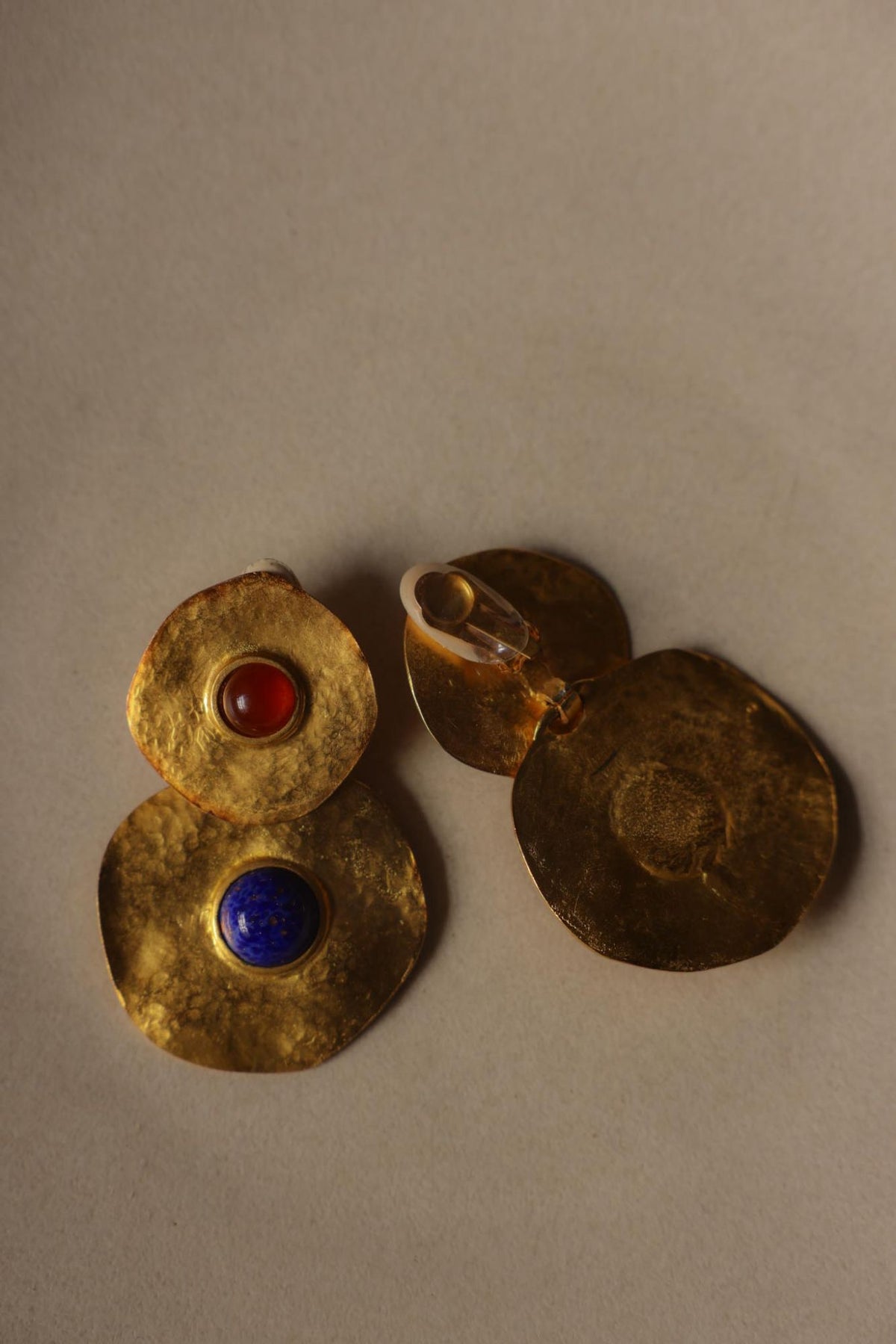 Front and back of the disc earrings showing the clip-on and hammered reverse