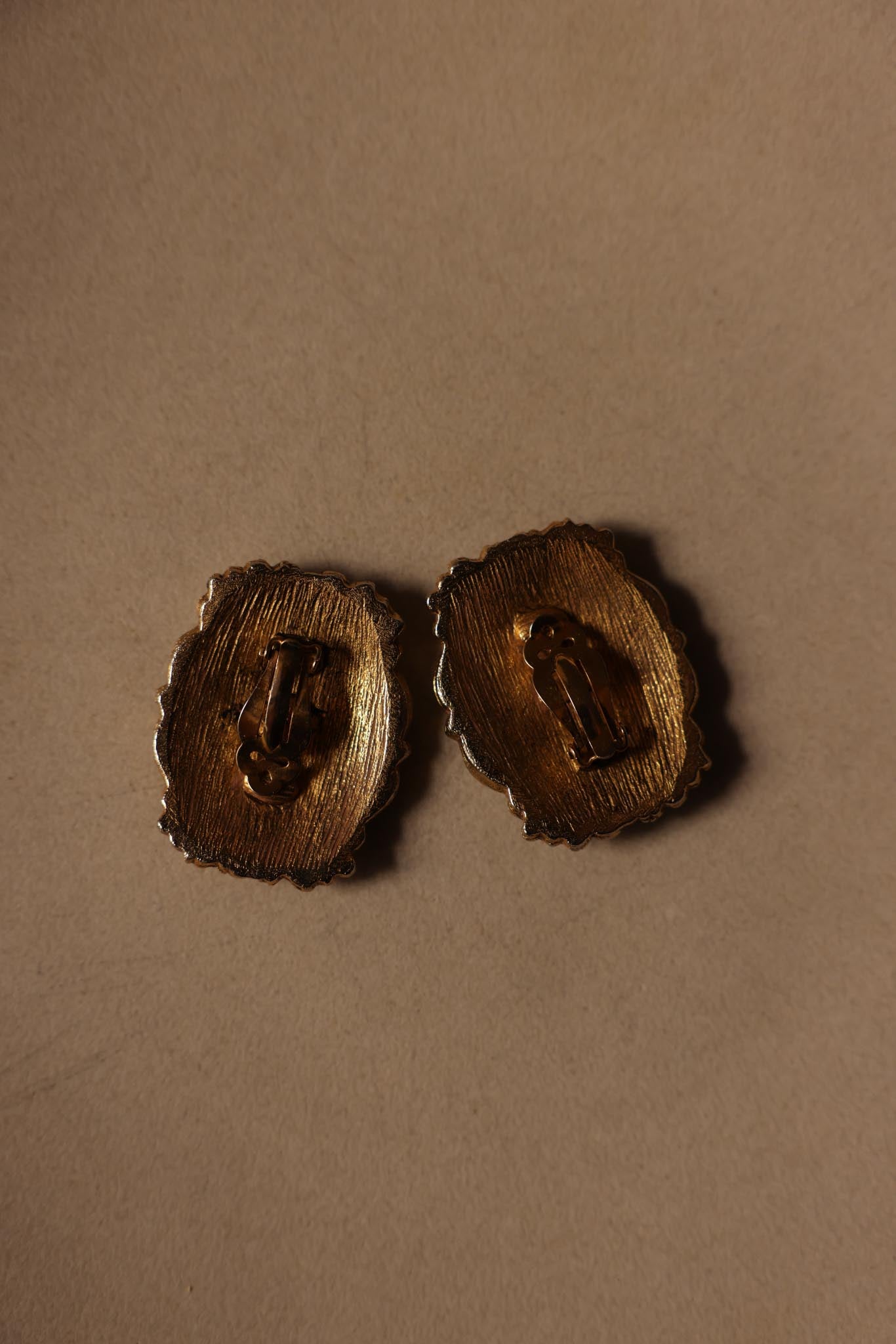Gold-Tone Floral Embossed Clip-On Earrings Signed M.E. – 1980s