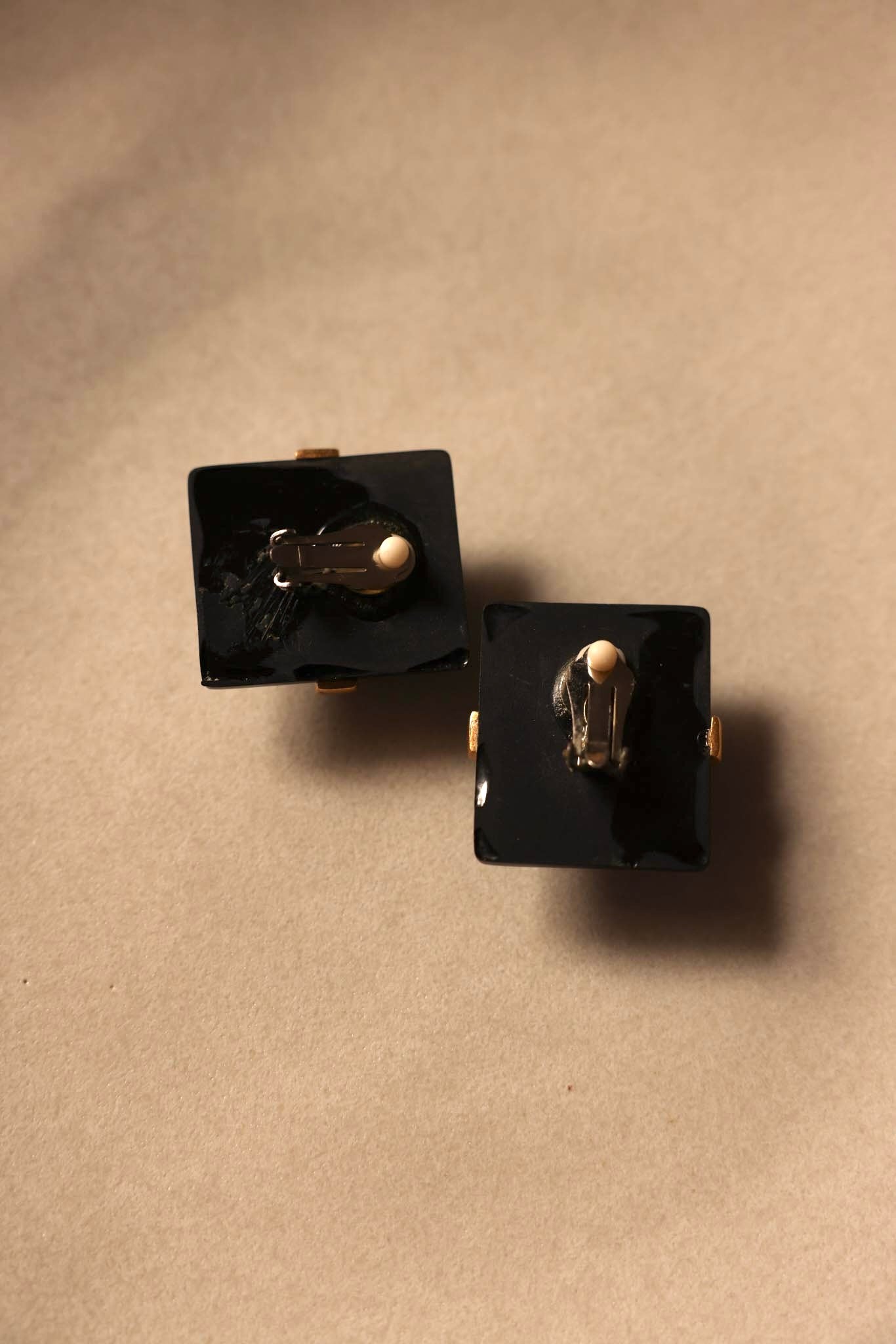 Geometric Black and Gold Clip-On Earrings with Green Accent