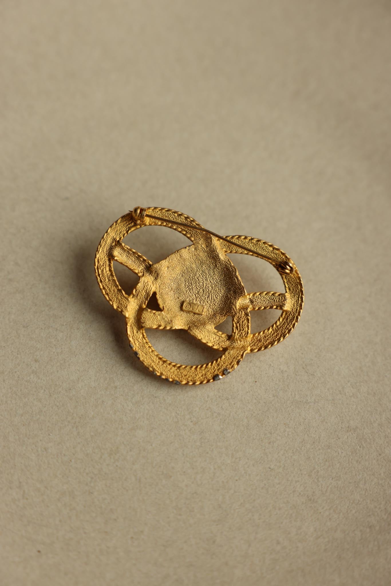JJ Gold Tone Knot Brooch With Brown Cabochon