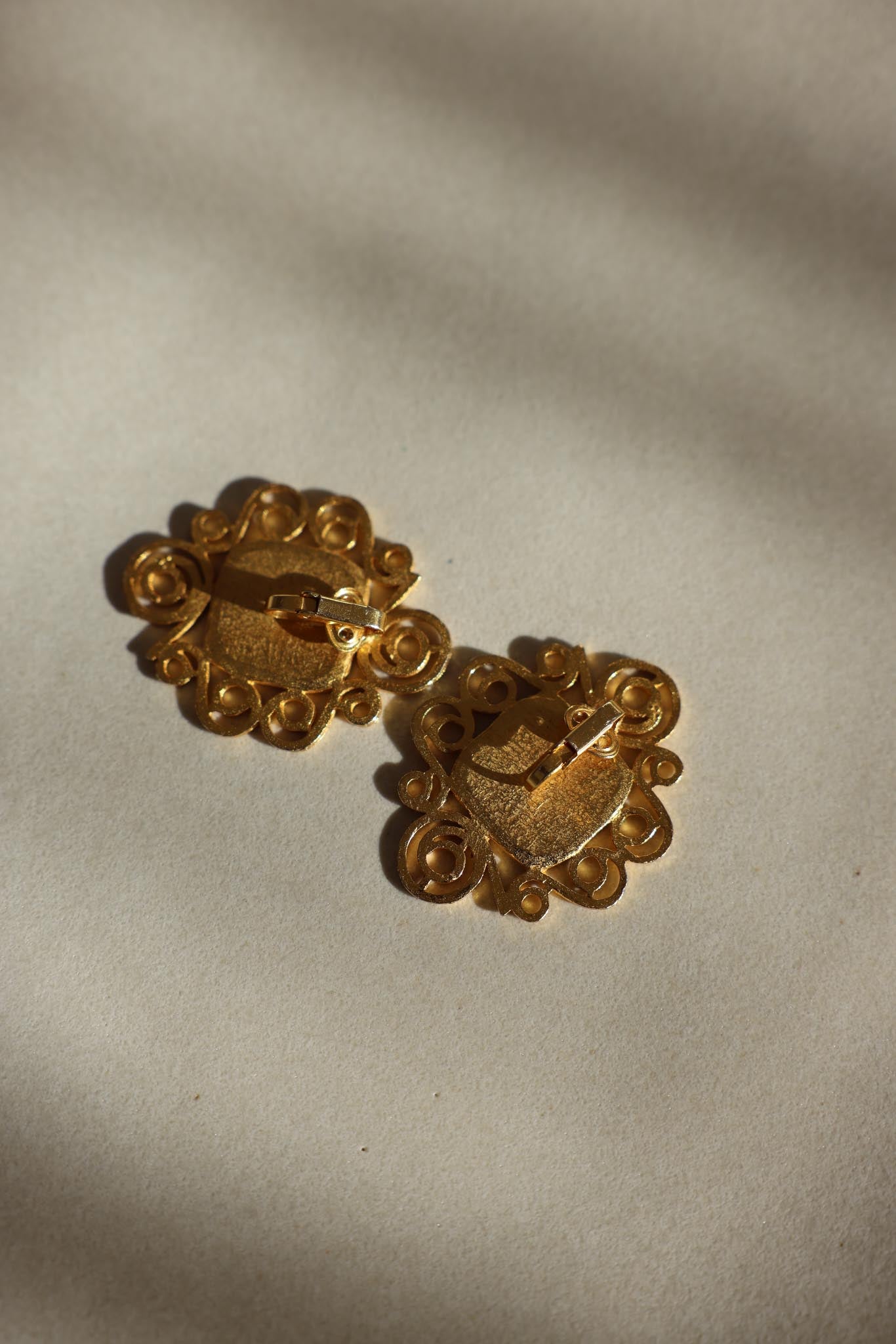 Gold-Tone Scroll Clip-On Earrings with Black Centers