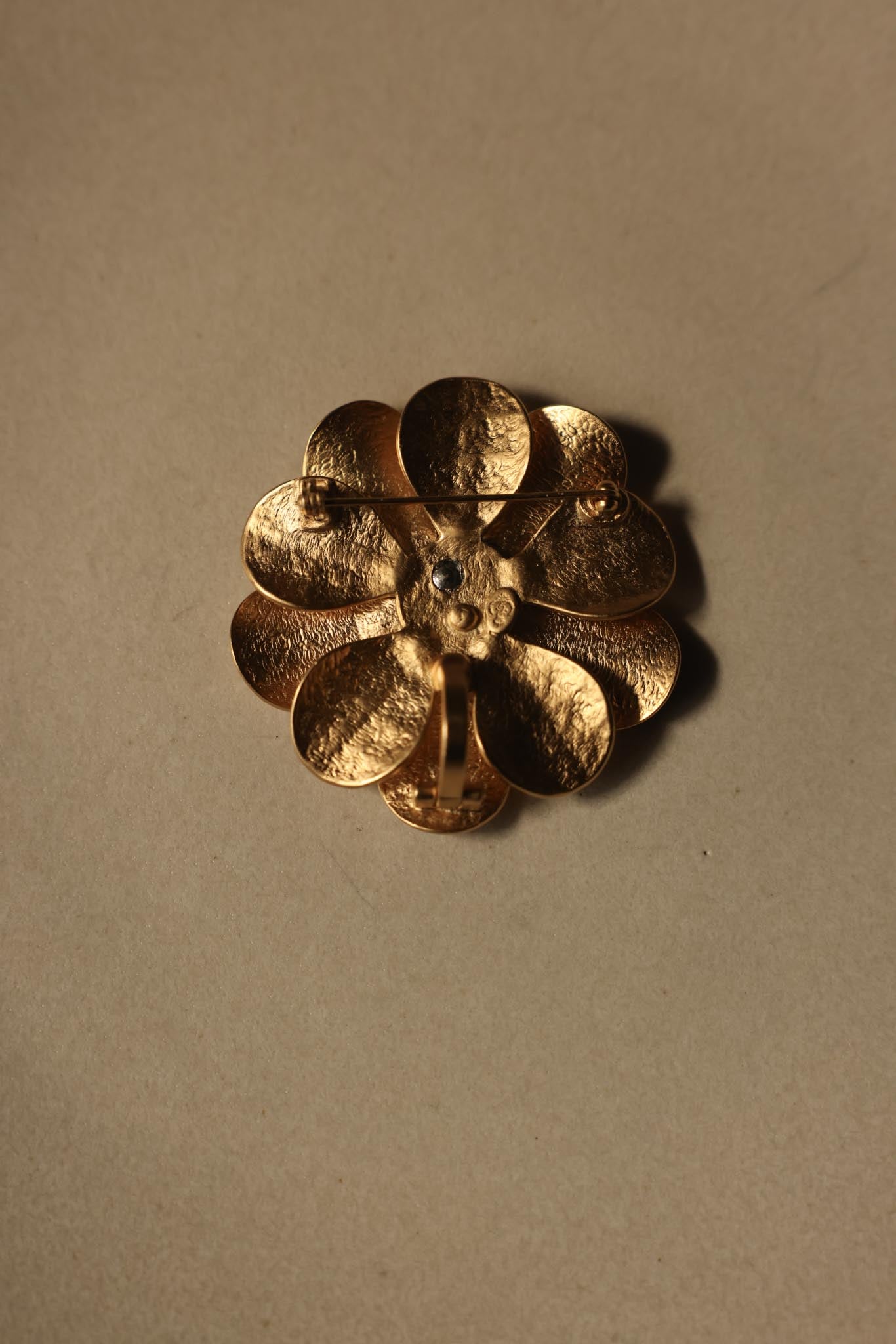 Brushed Gold Floral Brooch with Rhinestone Center