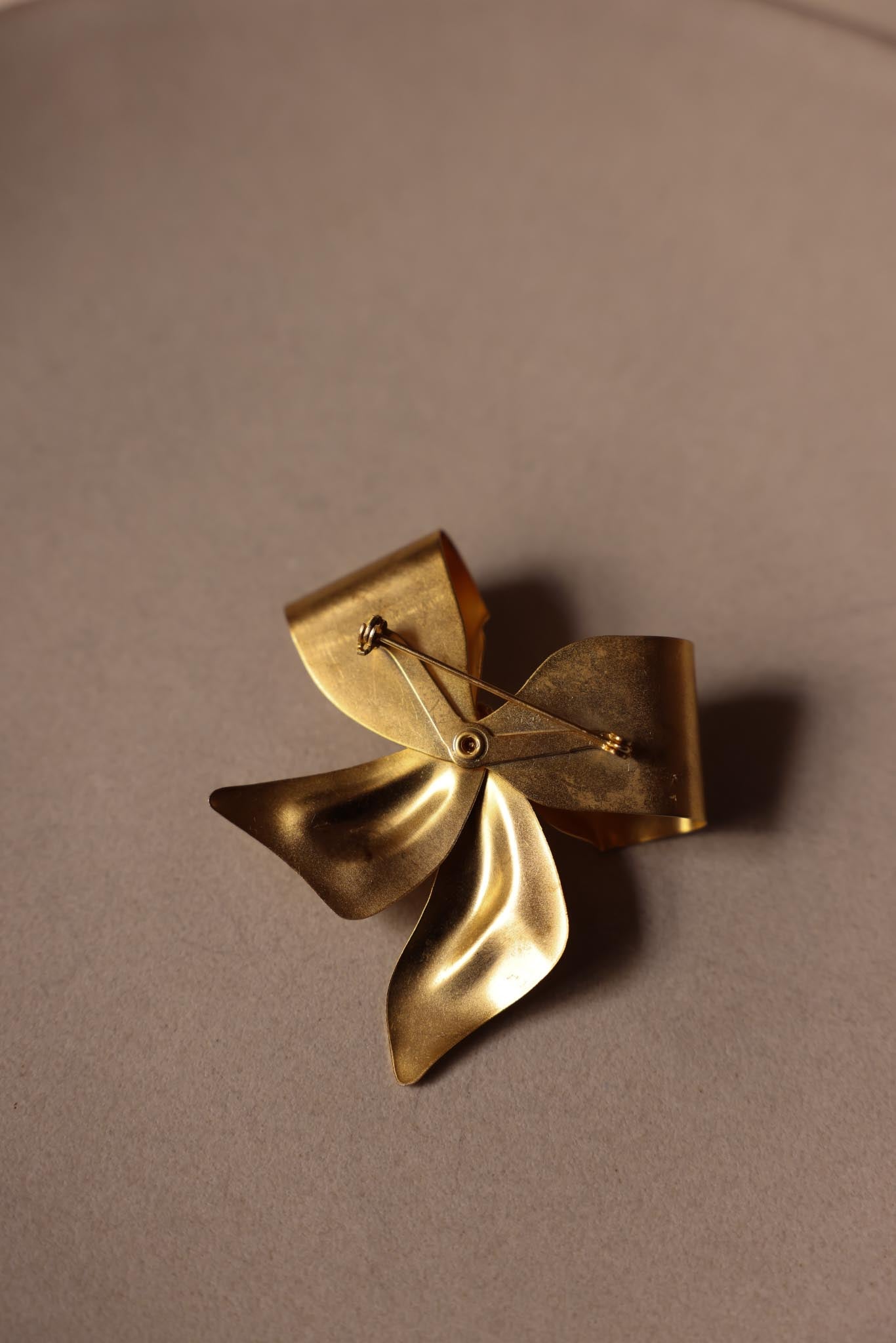 Matte Gold Bow Brooch with Clear Rhinestones