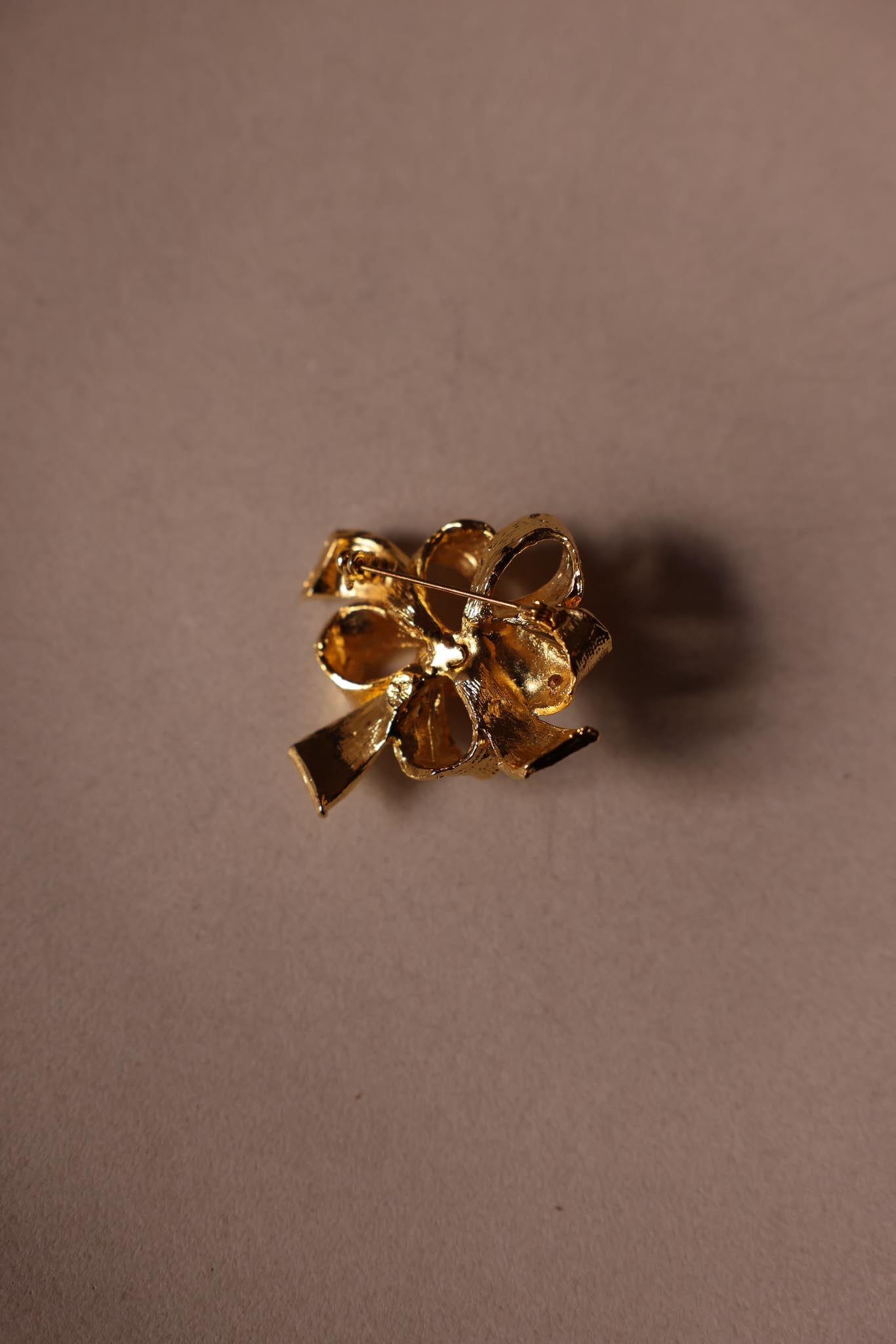 Gold Bow Brooch with Clear Rhinestones