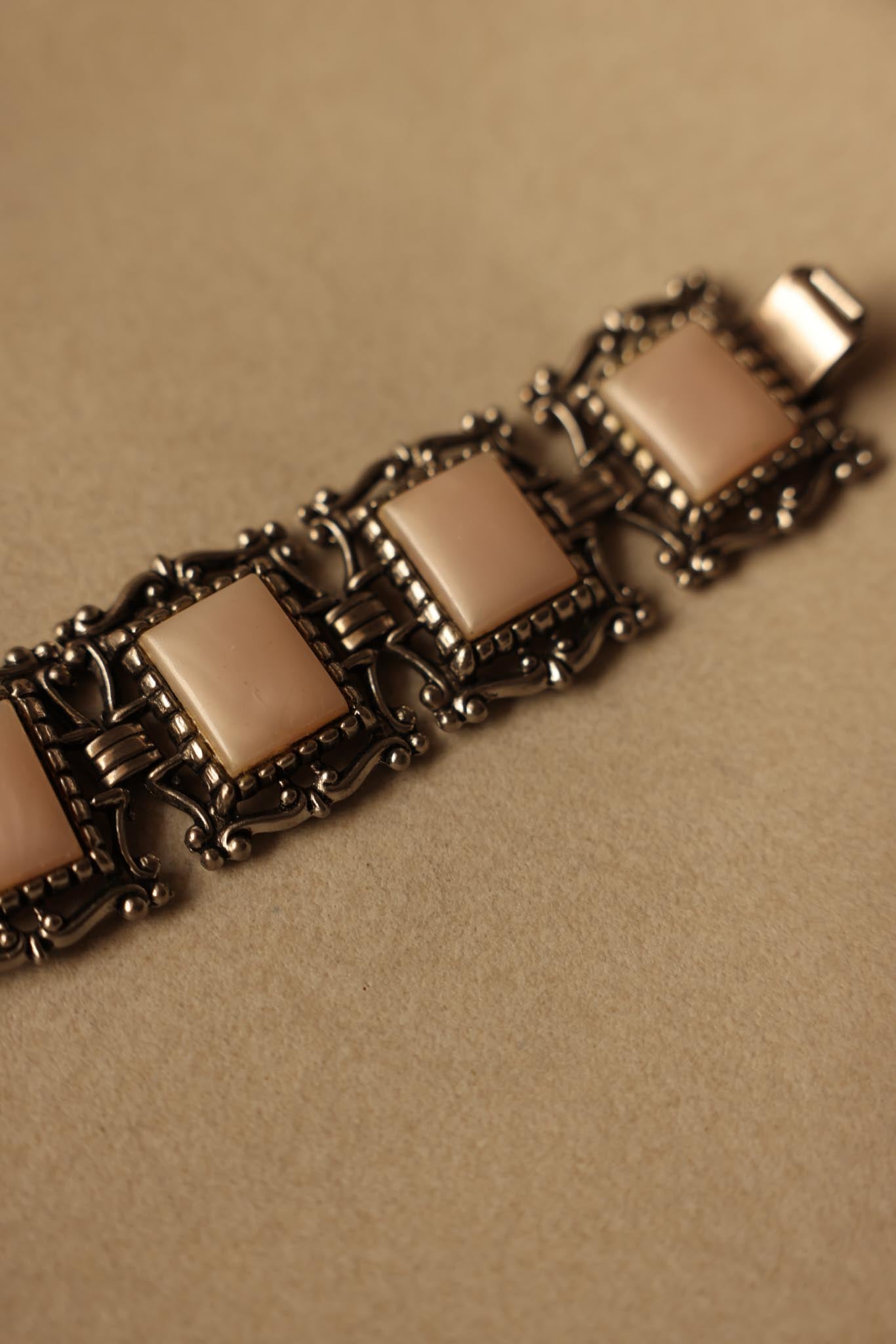 Silver-Tone Bracelet with Light Pink Cabochons