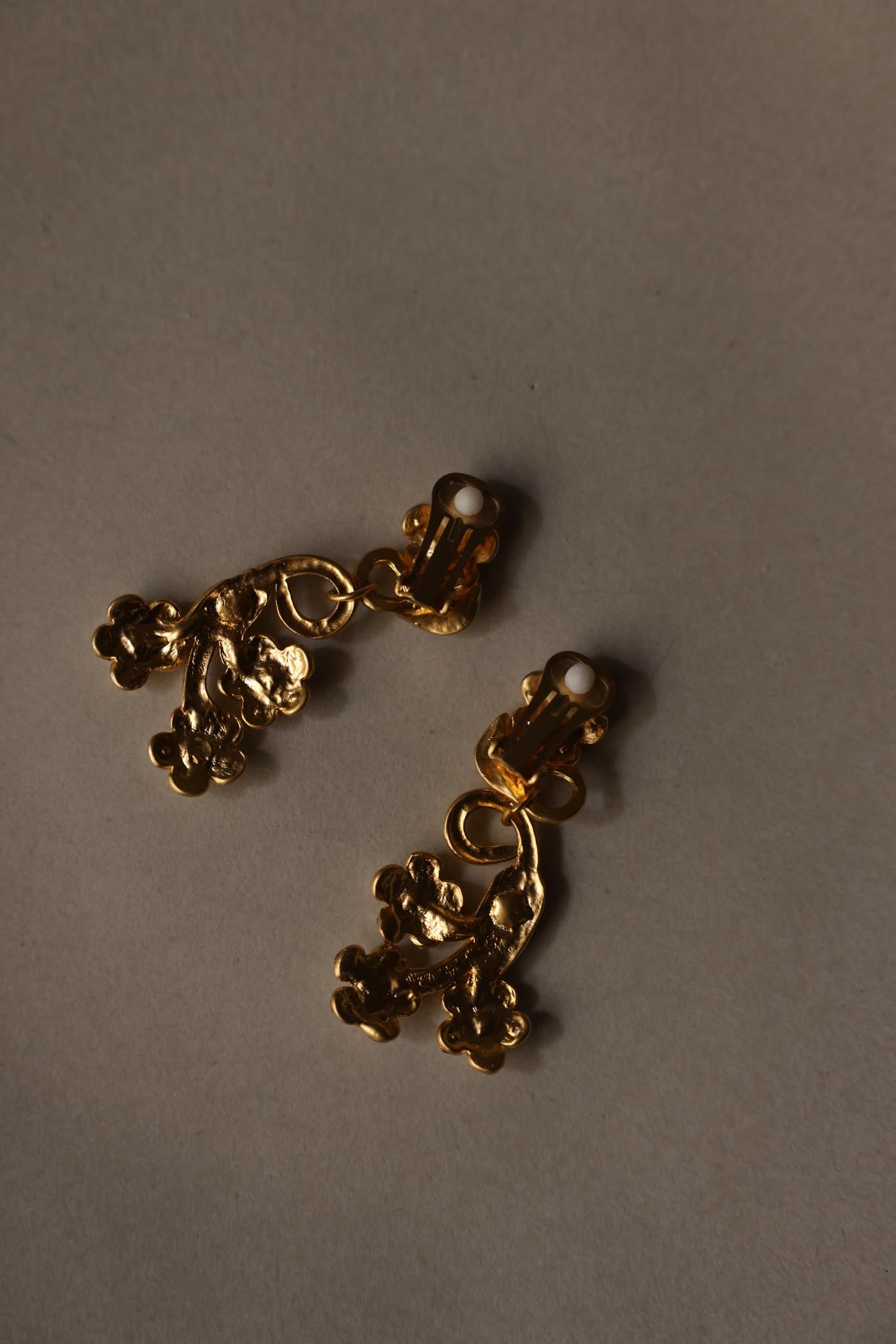 Matte Gold Rhinestone Swirl Clip-On Earrings