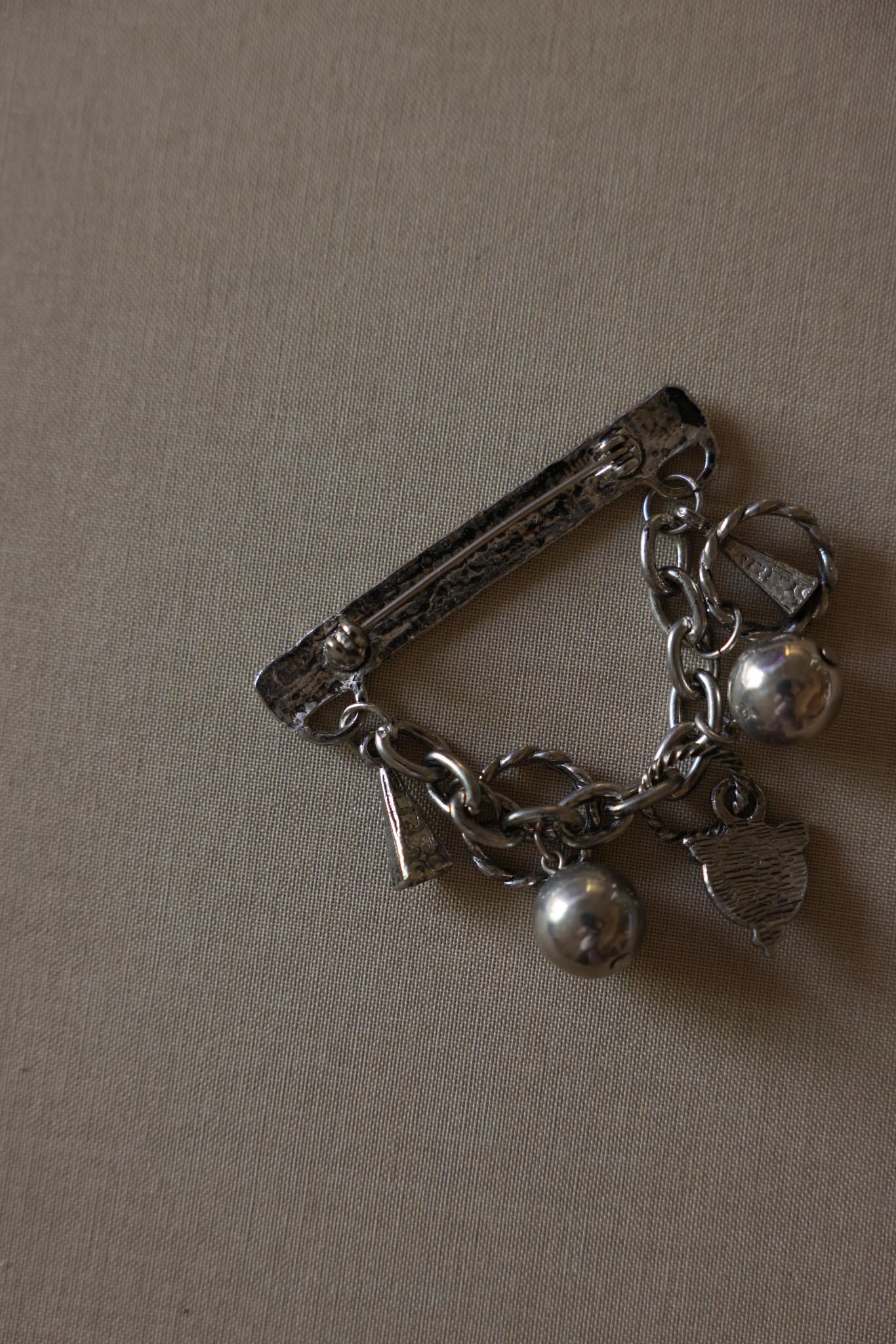 Les Bernard Silver-Tone Charm Brooch with Green Cabochon