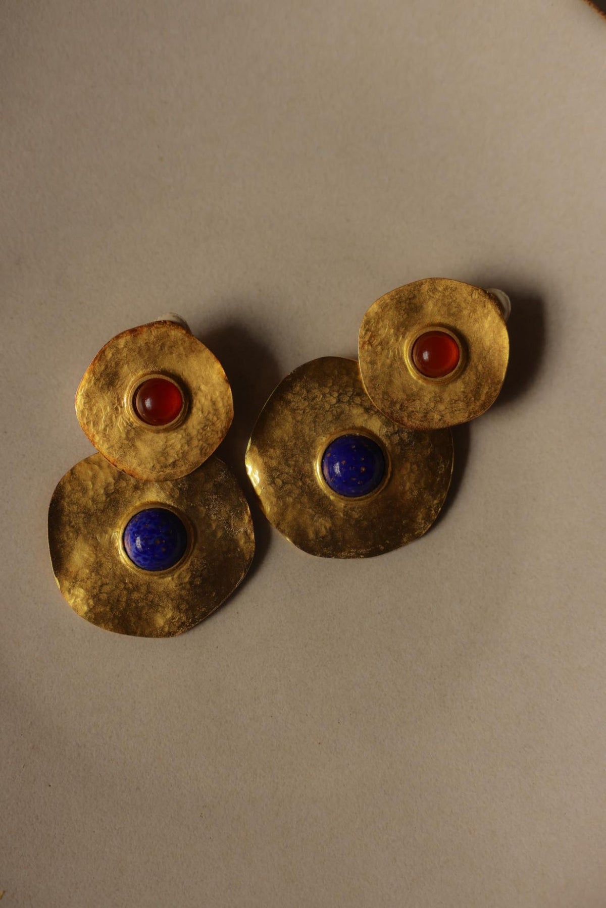 Pair of hammered gold tone double disc earrings with red and blue cabochons