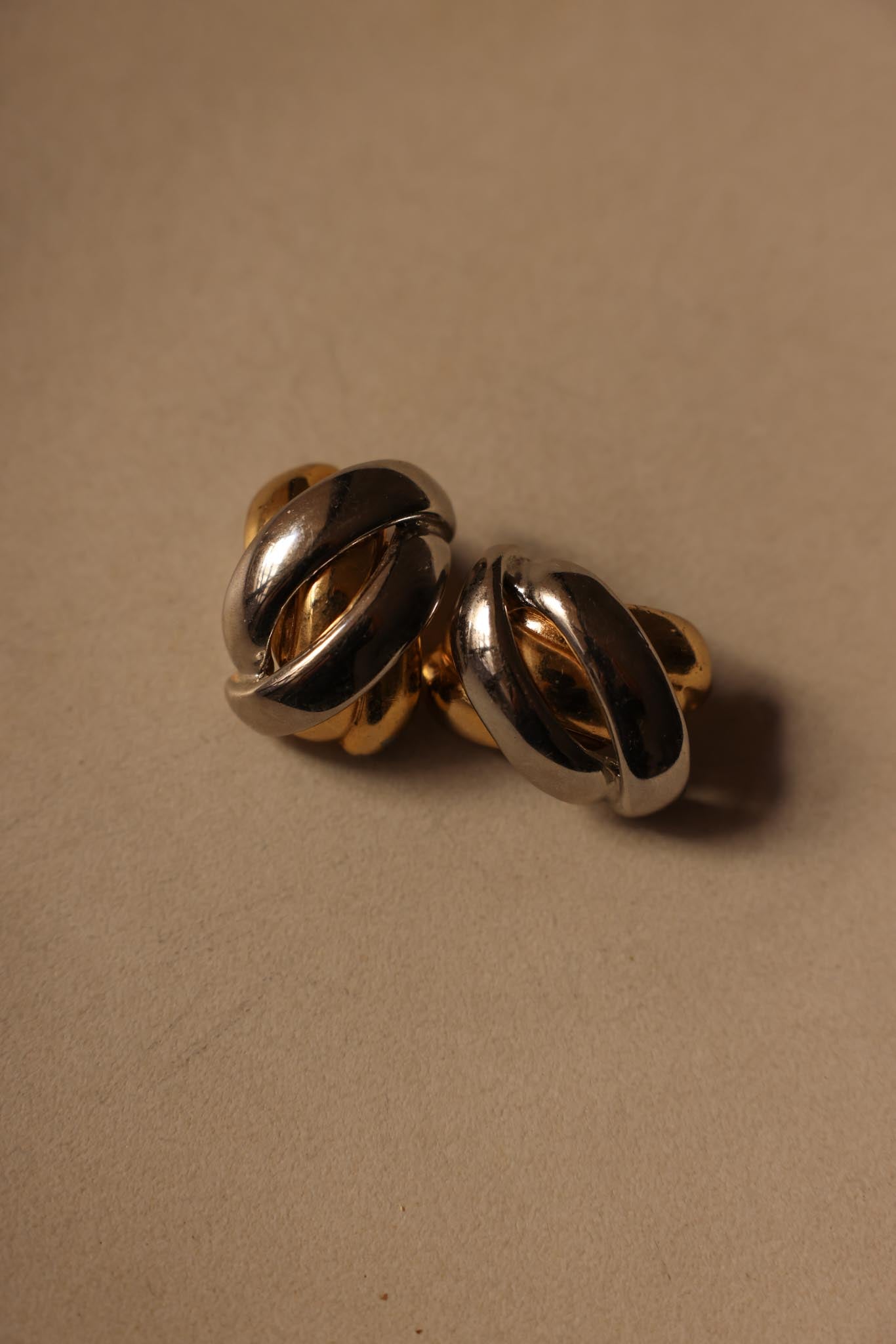 Two-Tone Clip-On Earrings with Bold Knot Design