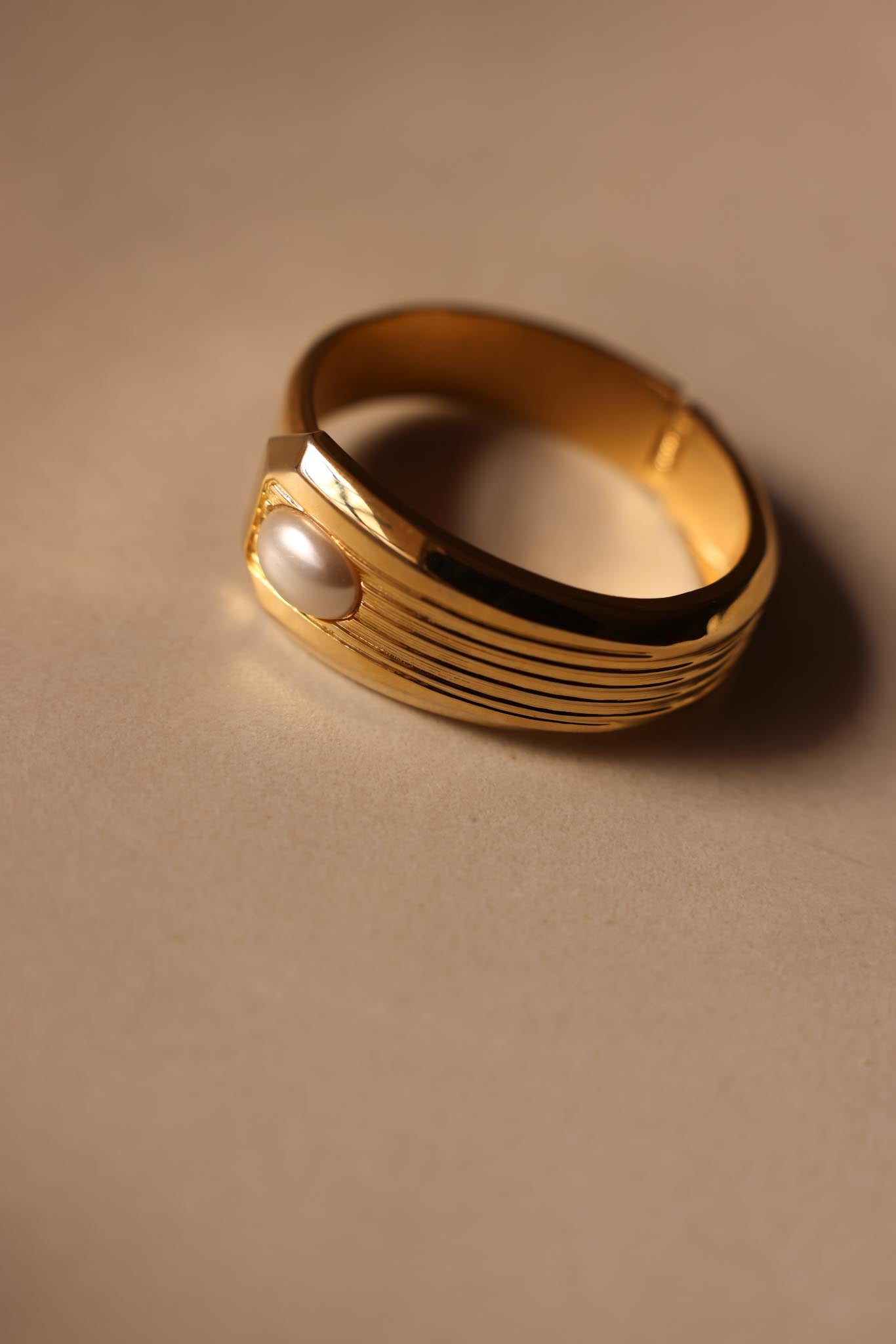 Gold-Tone Hinged Faux Pearl Bracelet