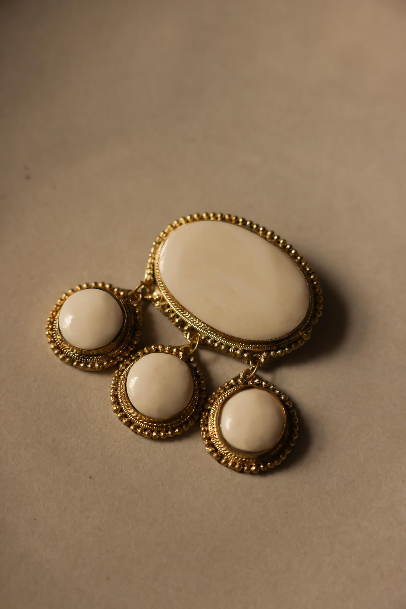 Gold-Tone Brooch with Ivory Cabochons
