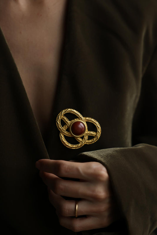 JJ Gold Tone Knot Brooch With Brown Cabochon