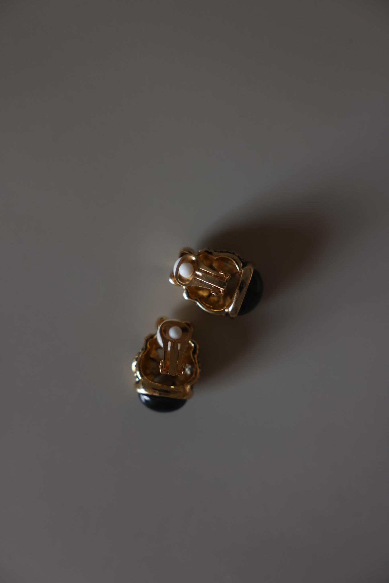 Gold Tone Black Cabochon Scroll Clip-On Earrings