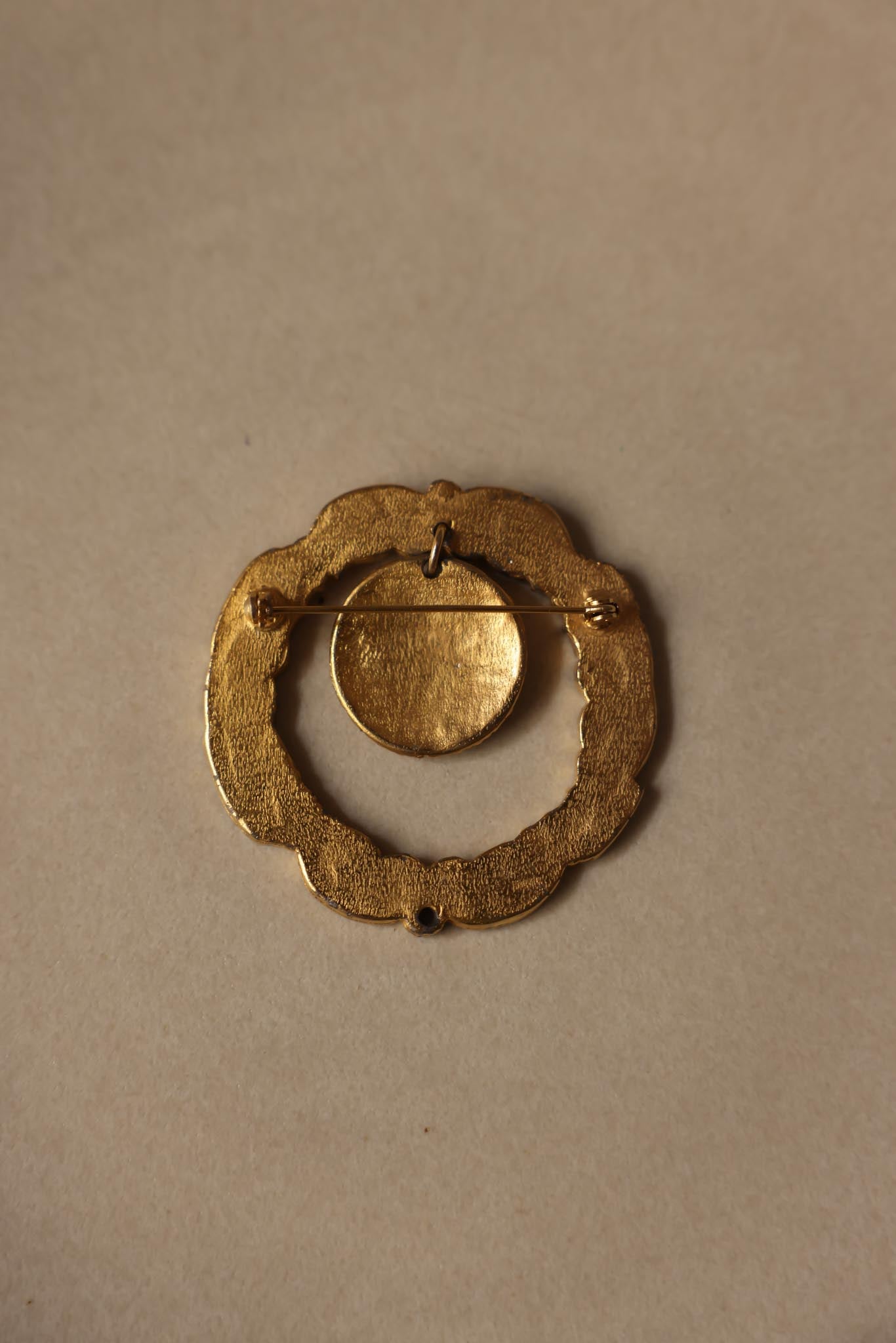 Gold-Tone Ornate Circular Brooch
