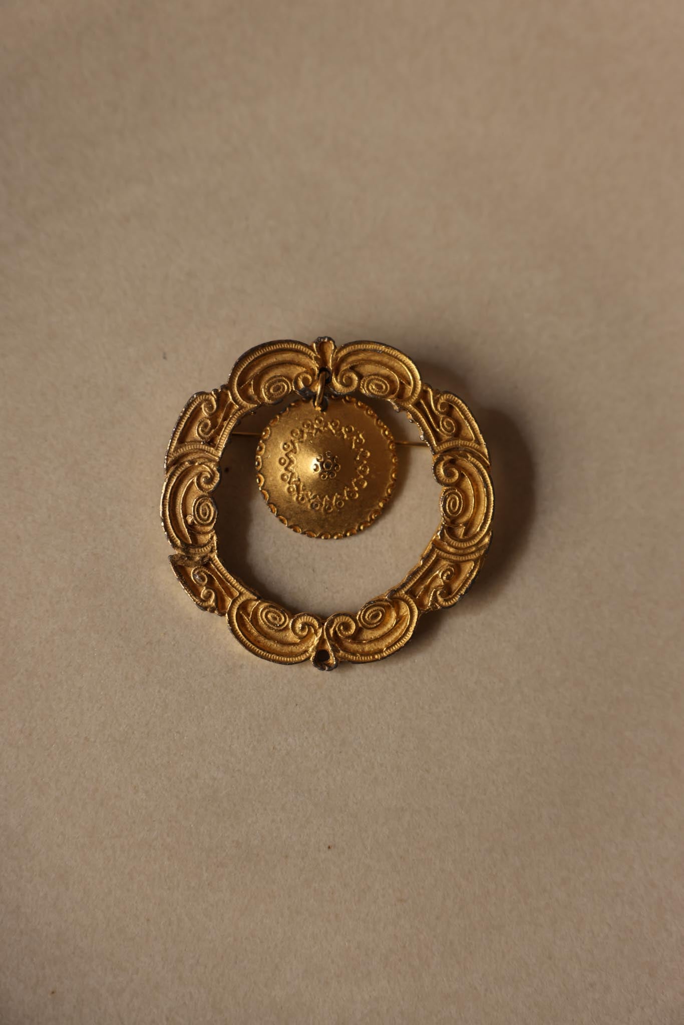 Gold-Tone Ornate Circular Brooch