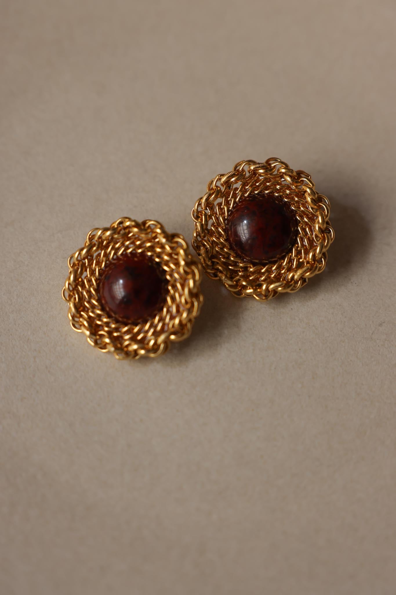 Gold Tone Woven Clip-On Earrings With Burgundy Cabochon