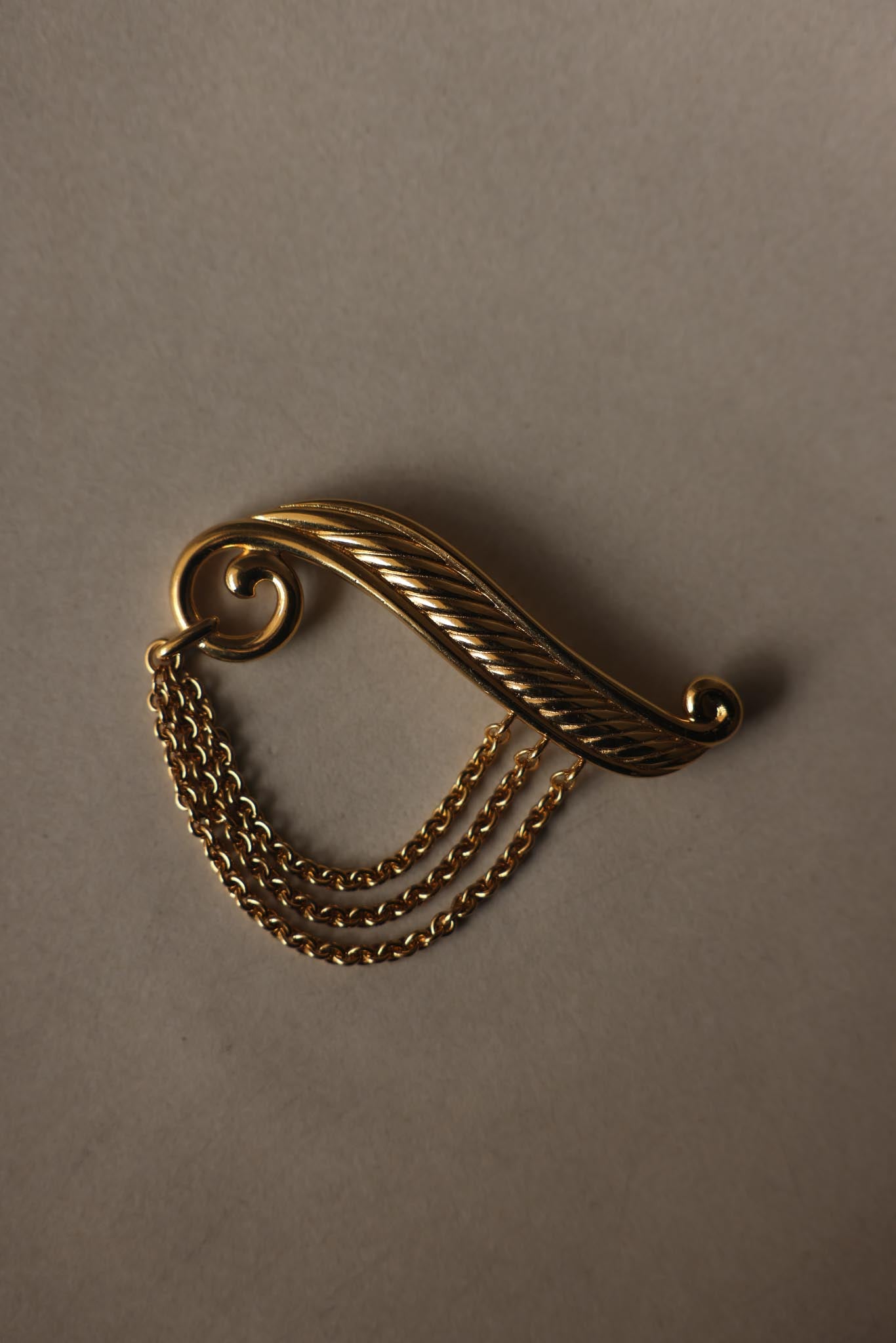 Gold Tone Scroll Brooch with Draped Chains