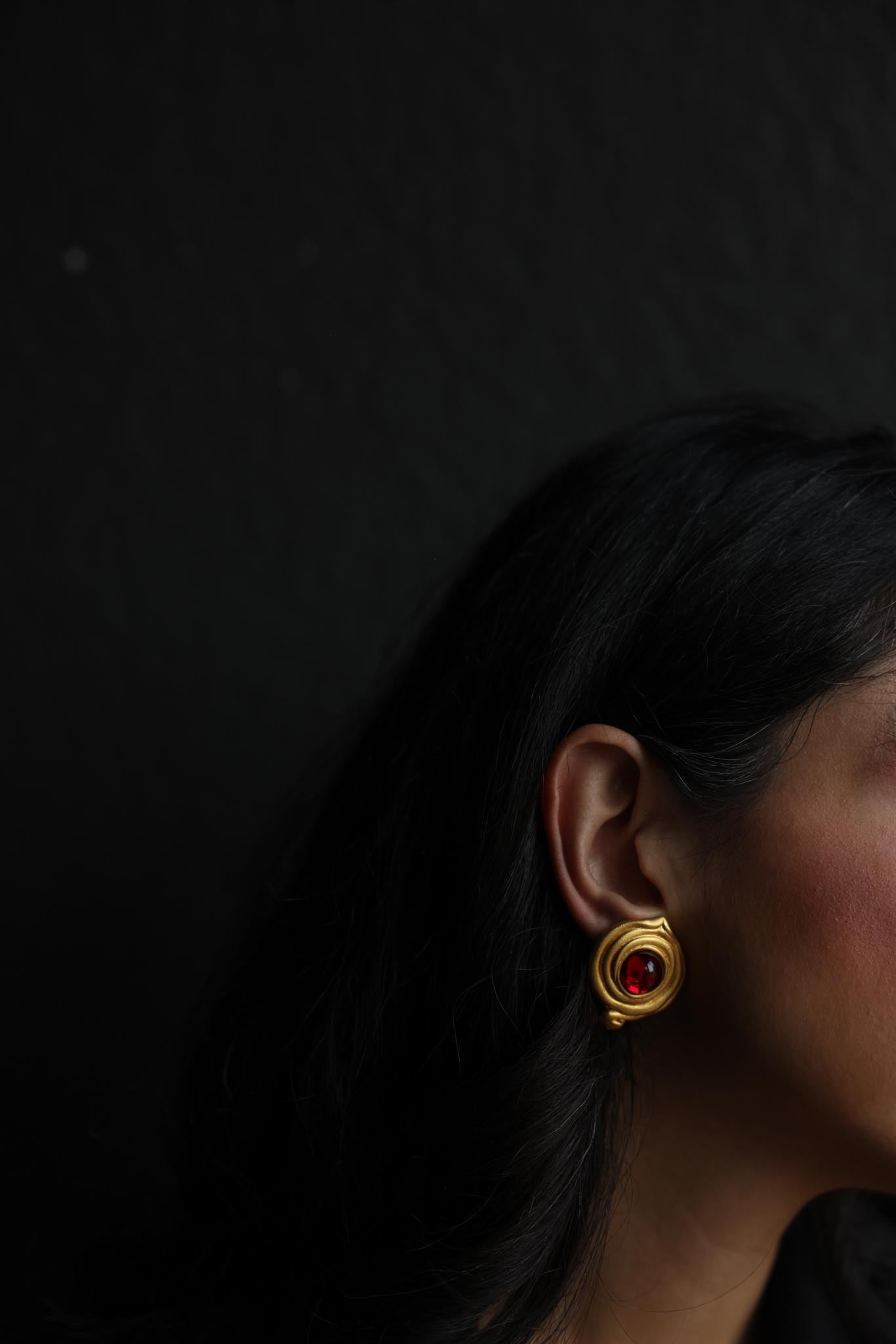 Matte Gold Swirl Clip-On Earrings with Red Cabochons