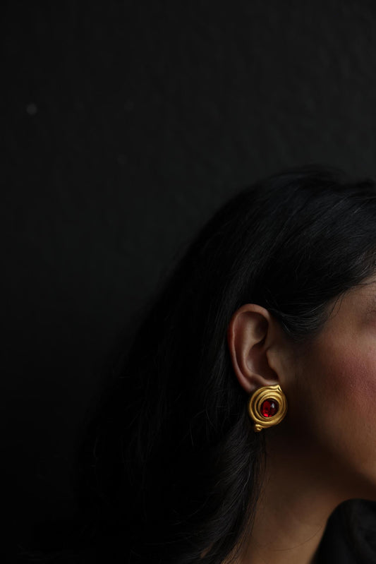 Matte Gold Swirl Clip-On Earrings with Red Cabochons