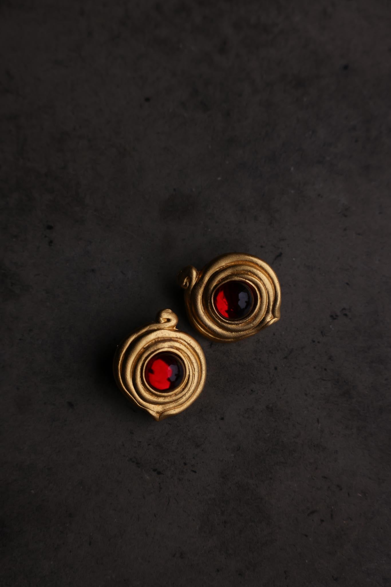 Matte Gold Swirl Clip-On Earrings with Red Cabochons