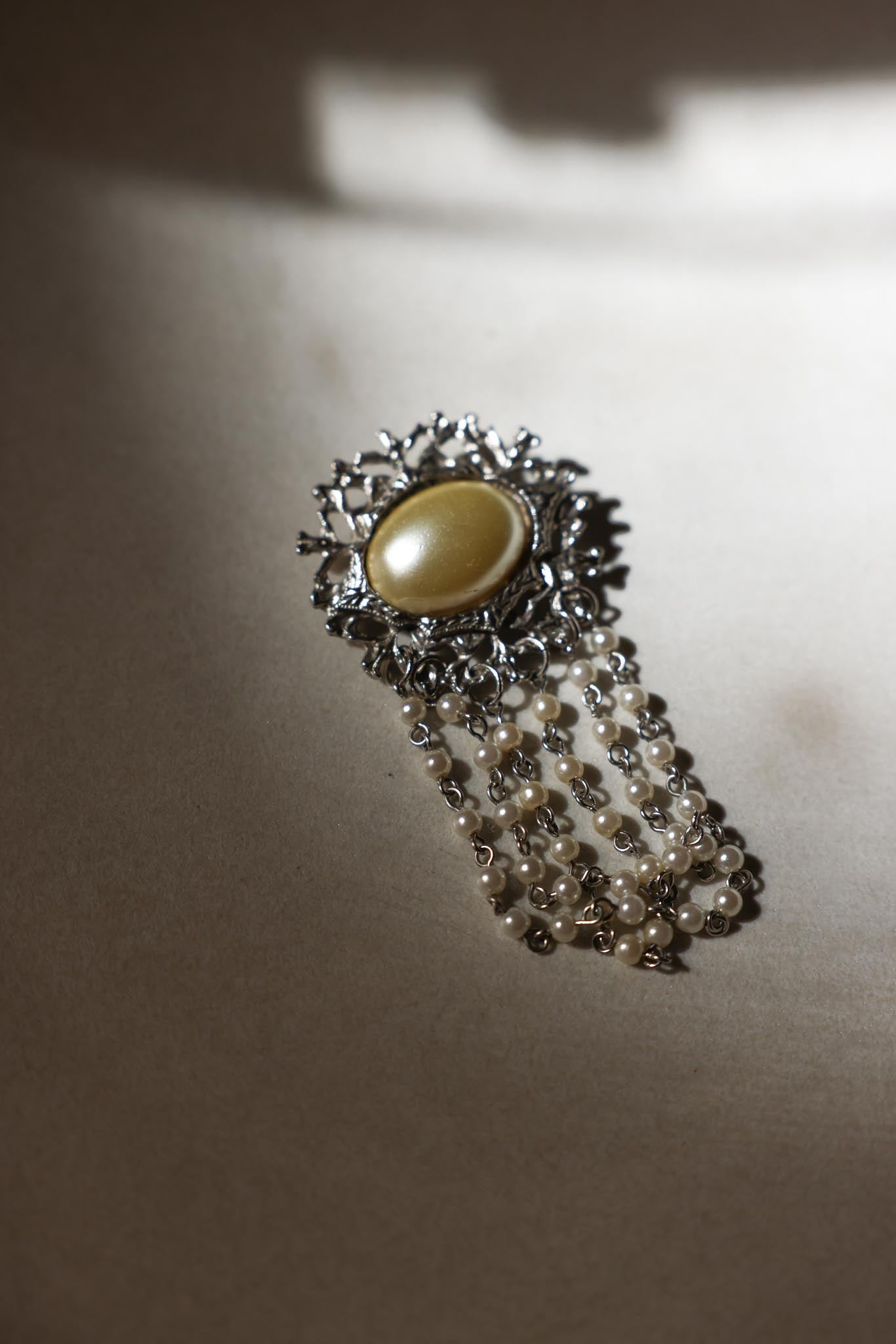 Silver-Tone Brooch with Faux Pearl and Draped Beaded Chains