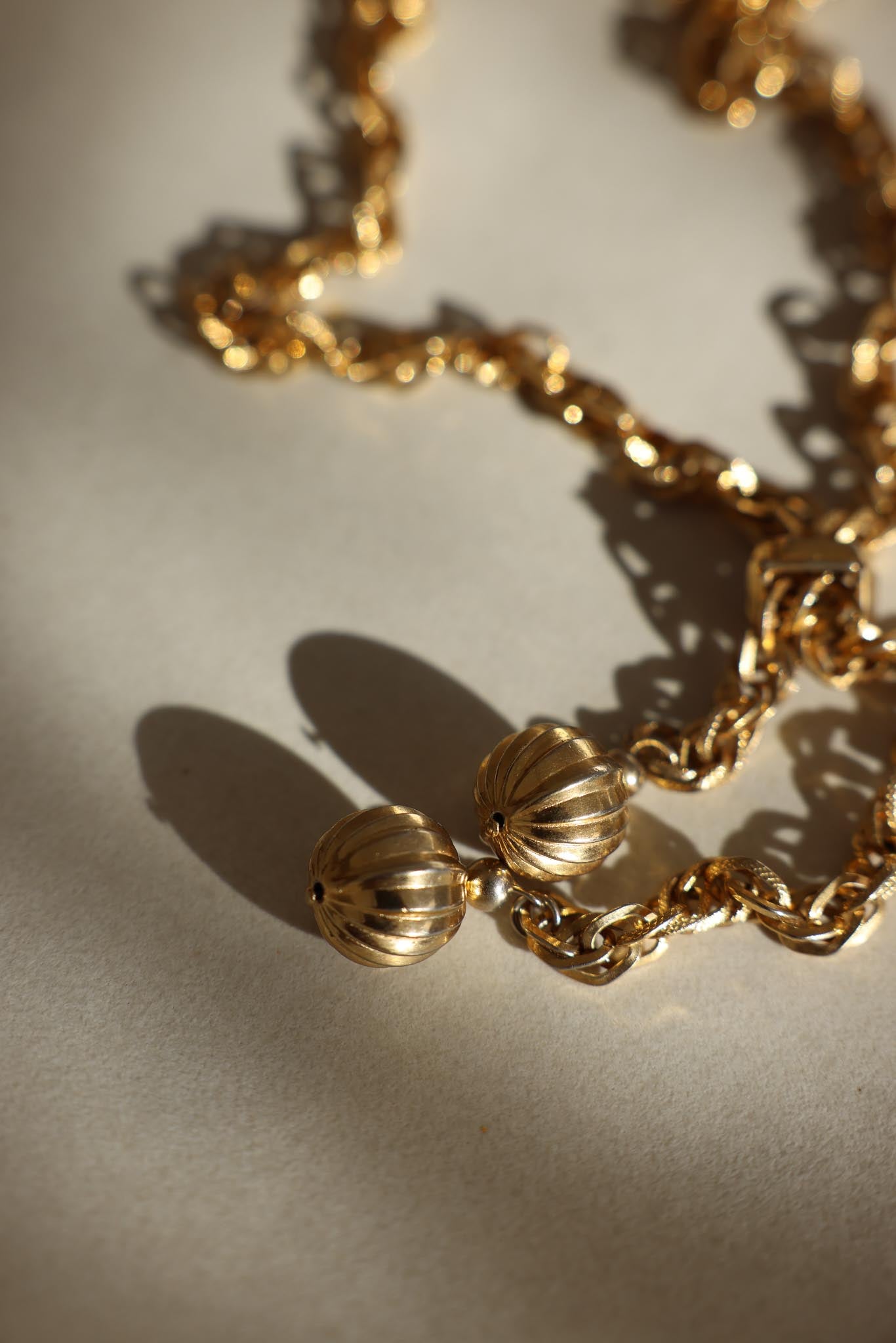 Gold-Tone Rope Chain Necklace with Ribbed Sphere Ends