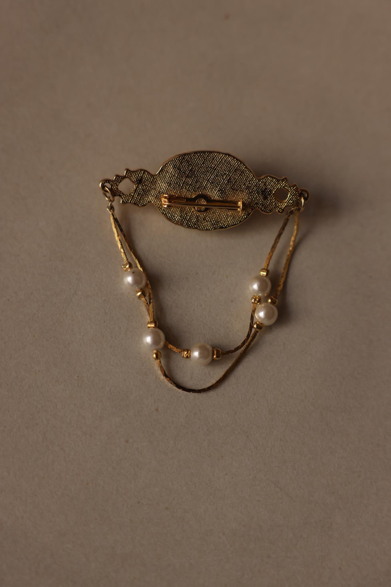 Gold-Tone Faux Pearl Chain Brooch with Draped Detail|Vintage Baazaar 