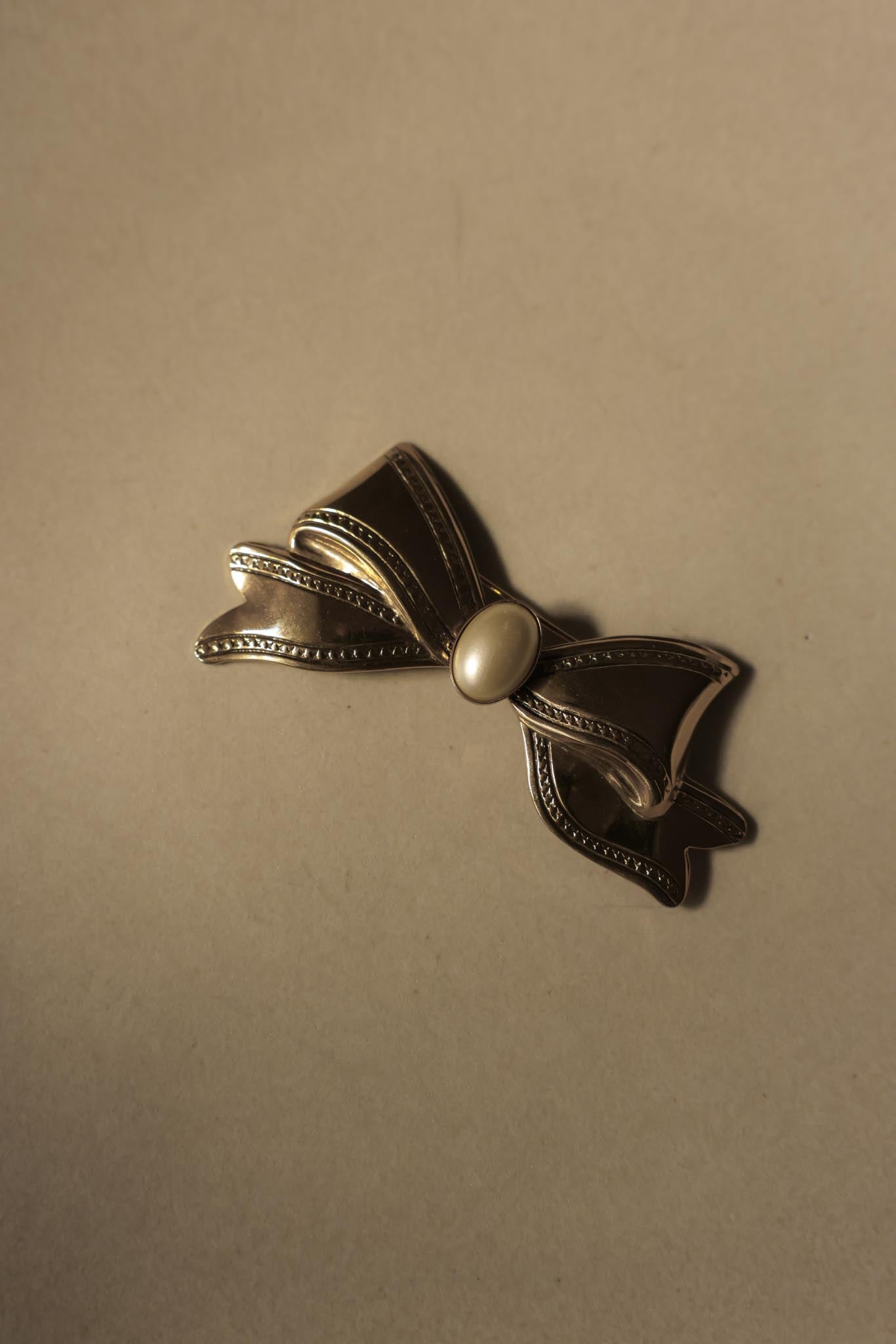 Gold-Tone Bow Brooch with Faux Pearl Center