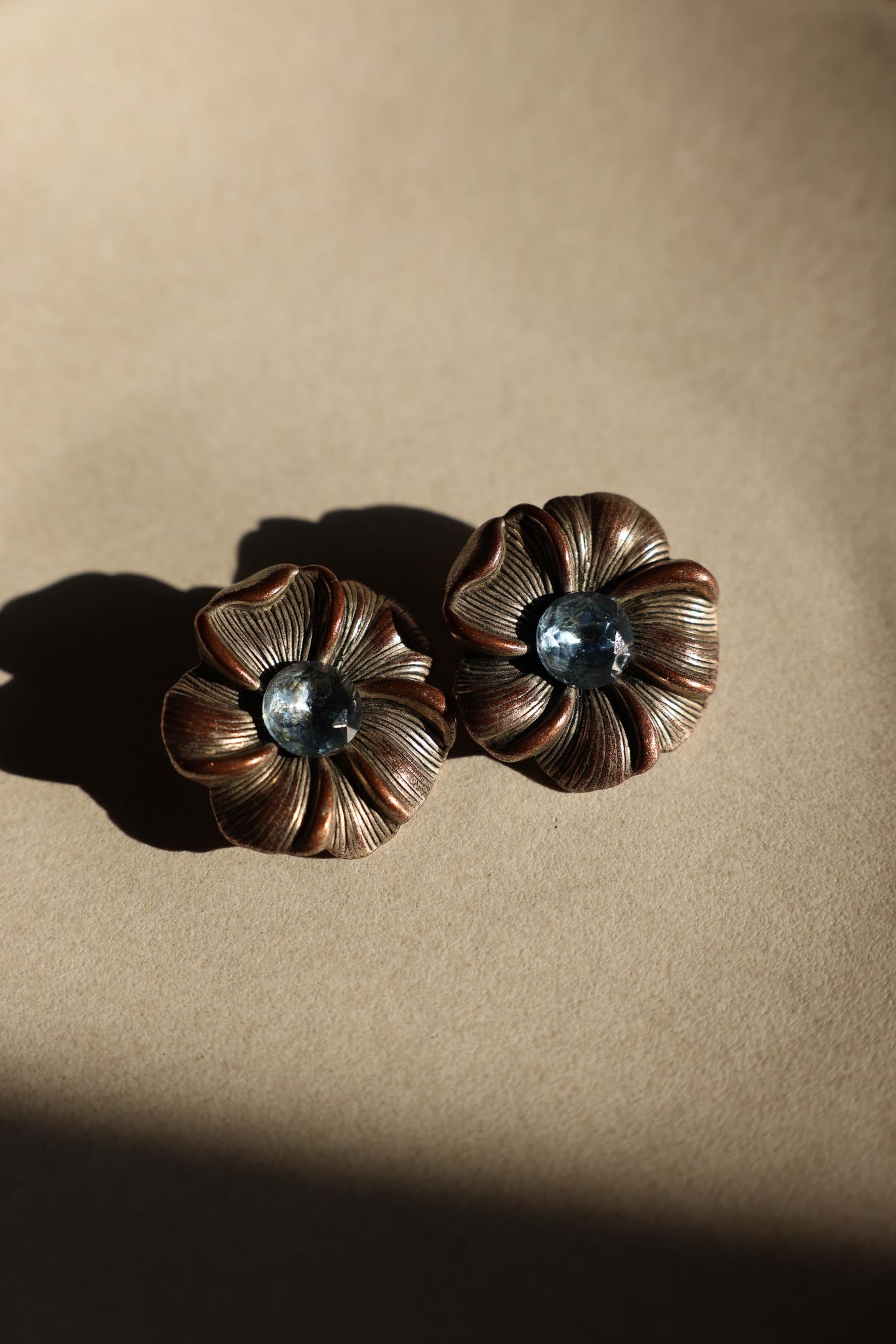 Silver Flower Clip-On Earrings with Blue Cabochon