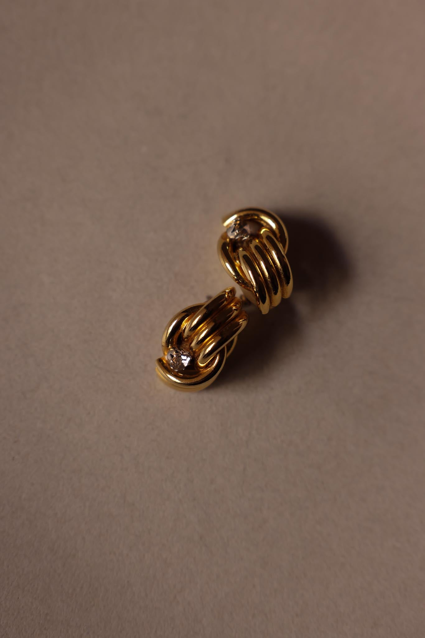 Twisted Gold Knot Earrings with Rhinestone Detail