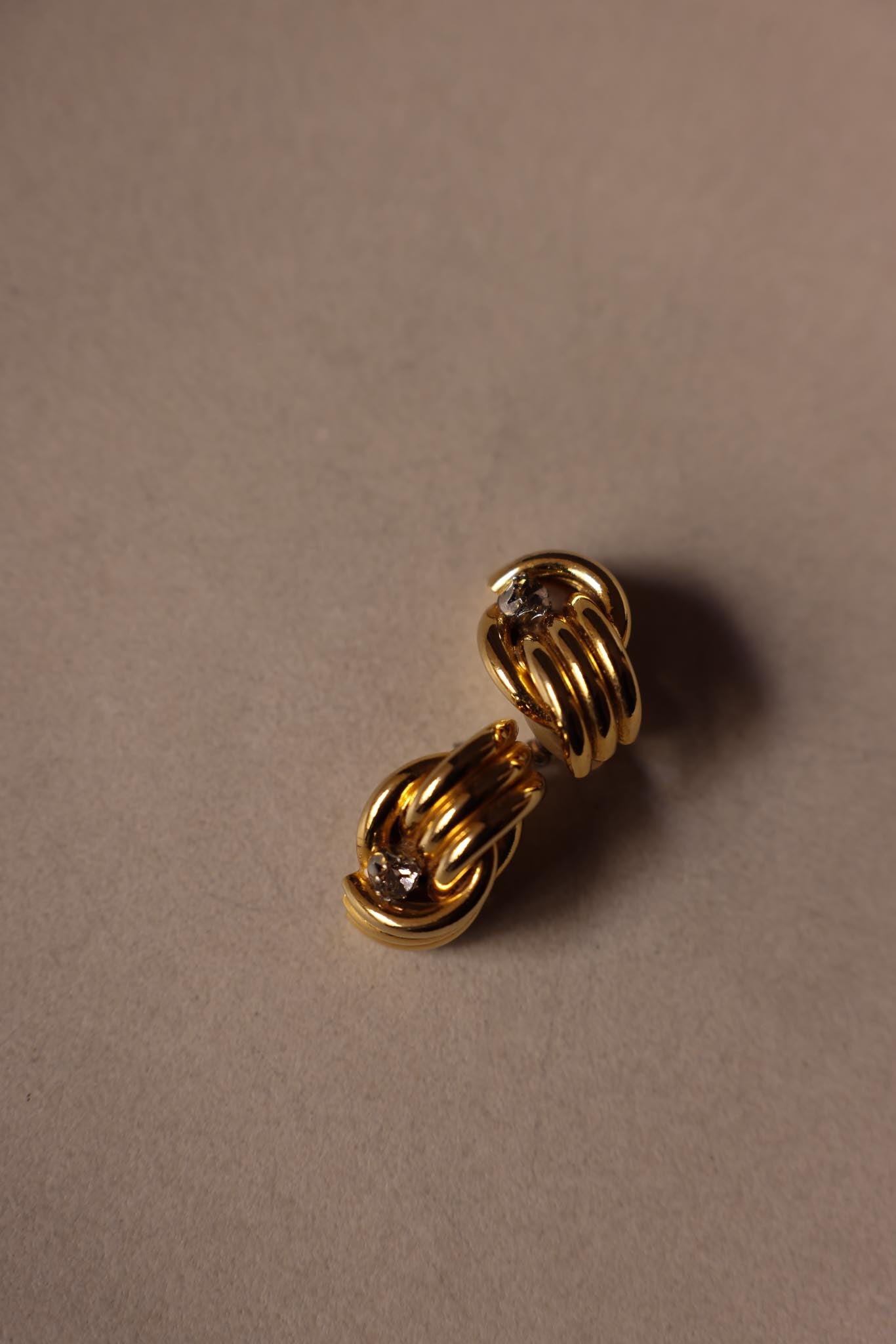 Twisted Gold Knot Earrings with Rhinestone Detail