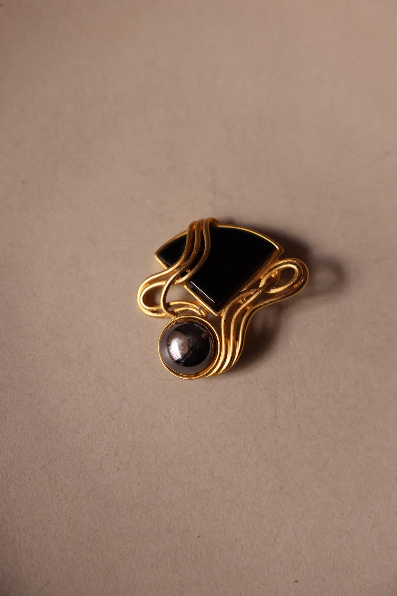 Matte Gold Abstract Brooch with Black and Silver Accents