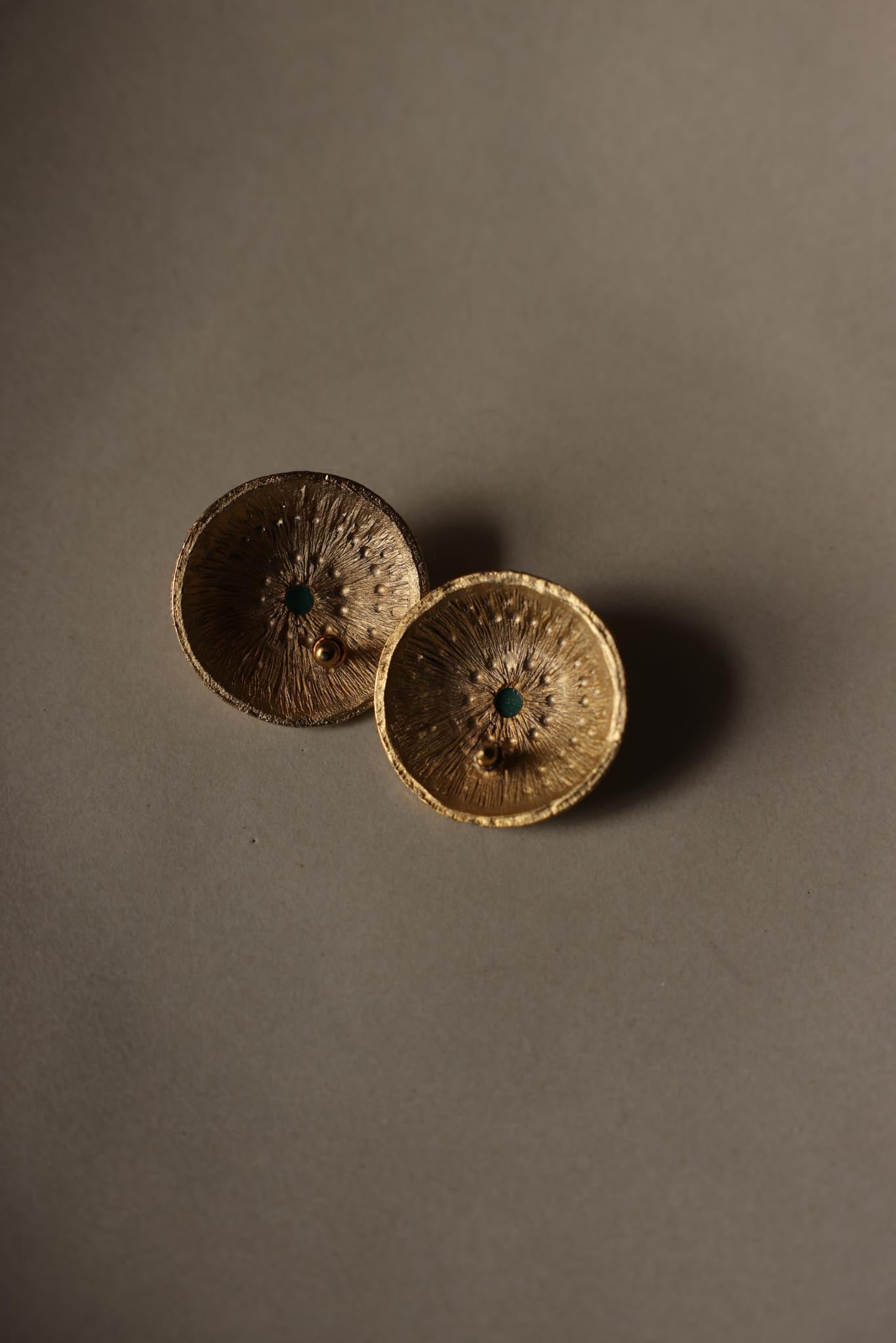 Gold Tone Textured Disc Pierced Earrings with Green Center