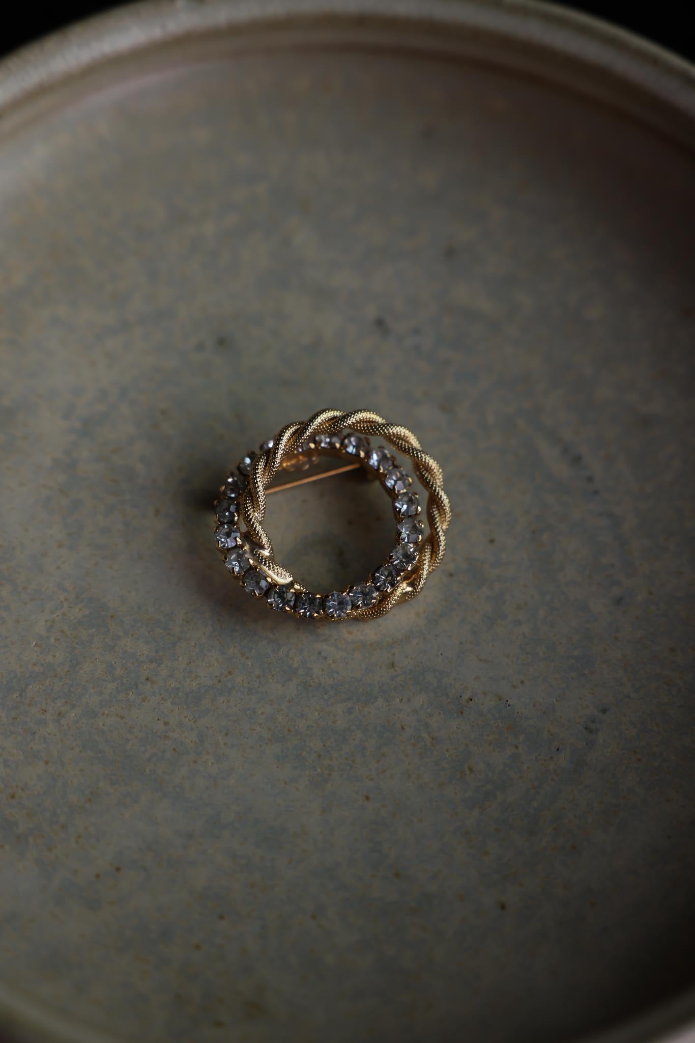 Gold-Tone Braided Circle Brooch with Clear Rhinestones