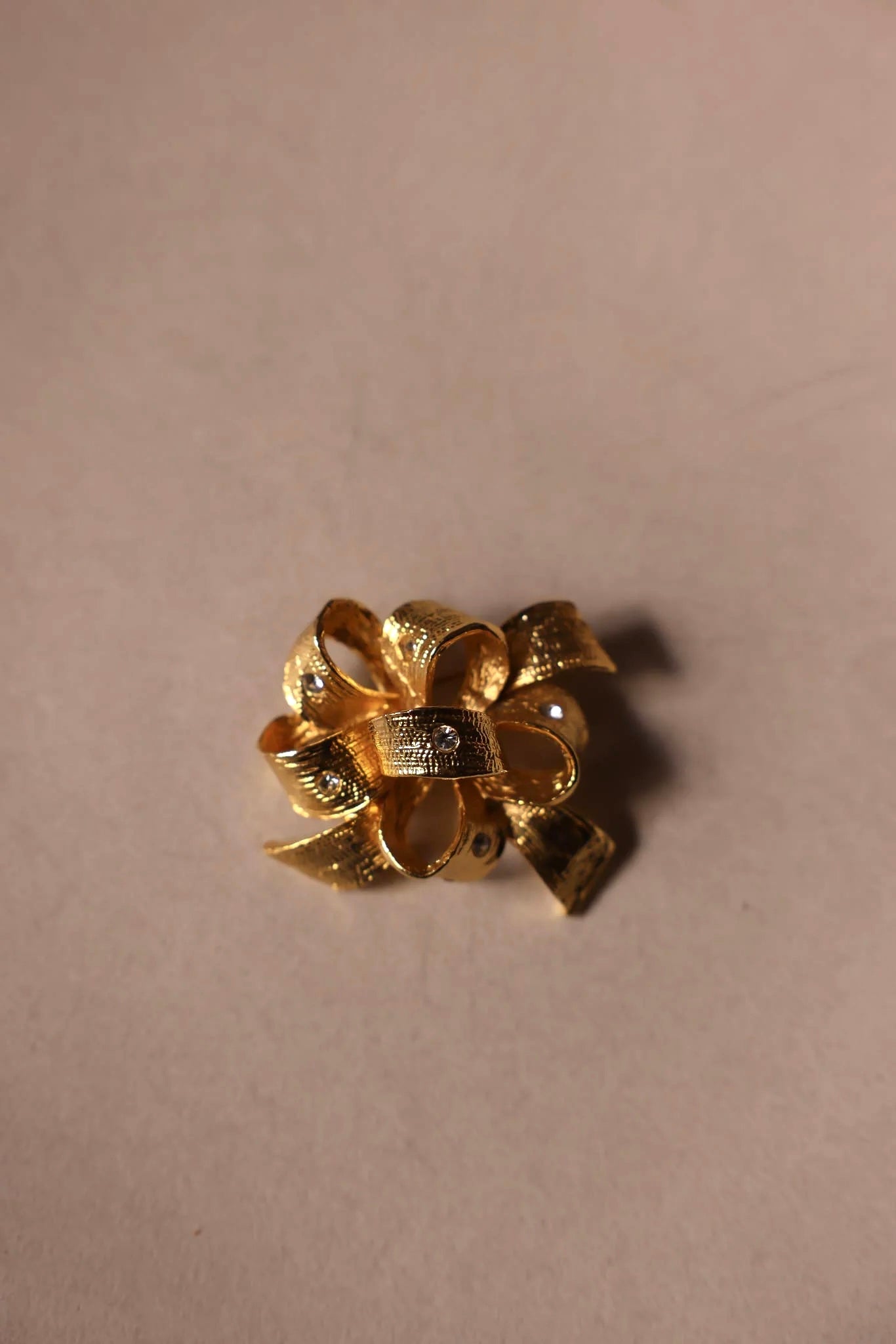 Gold Bow Brooch with Clear Rhinestones