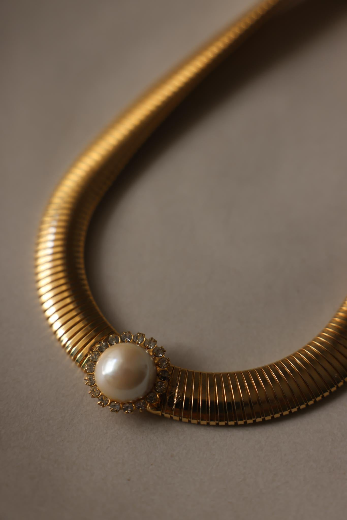Gold Tone Omega Necklace with Faux Pearl & Rhinestone Center