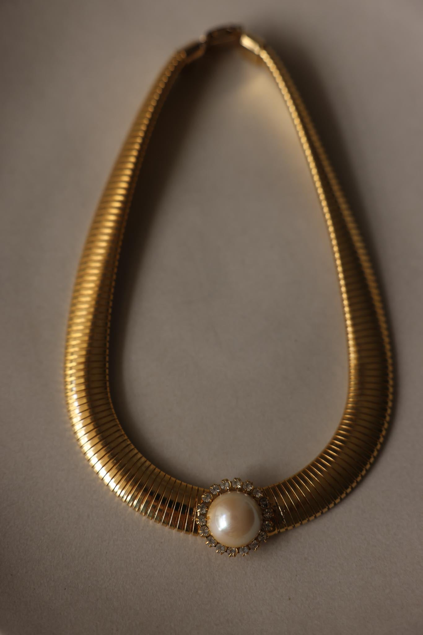 Gold Tone Omega Necklace with Faux Pearl & Rhinestone Center