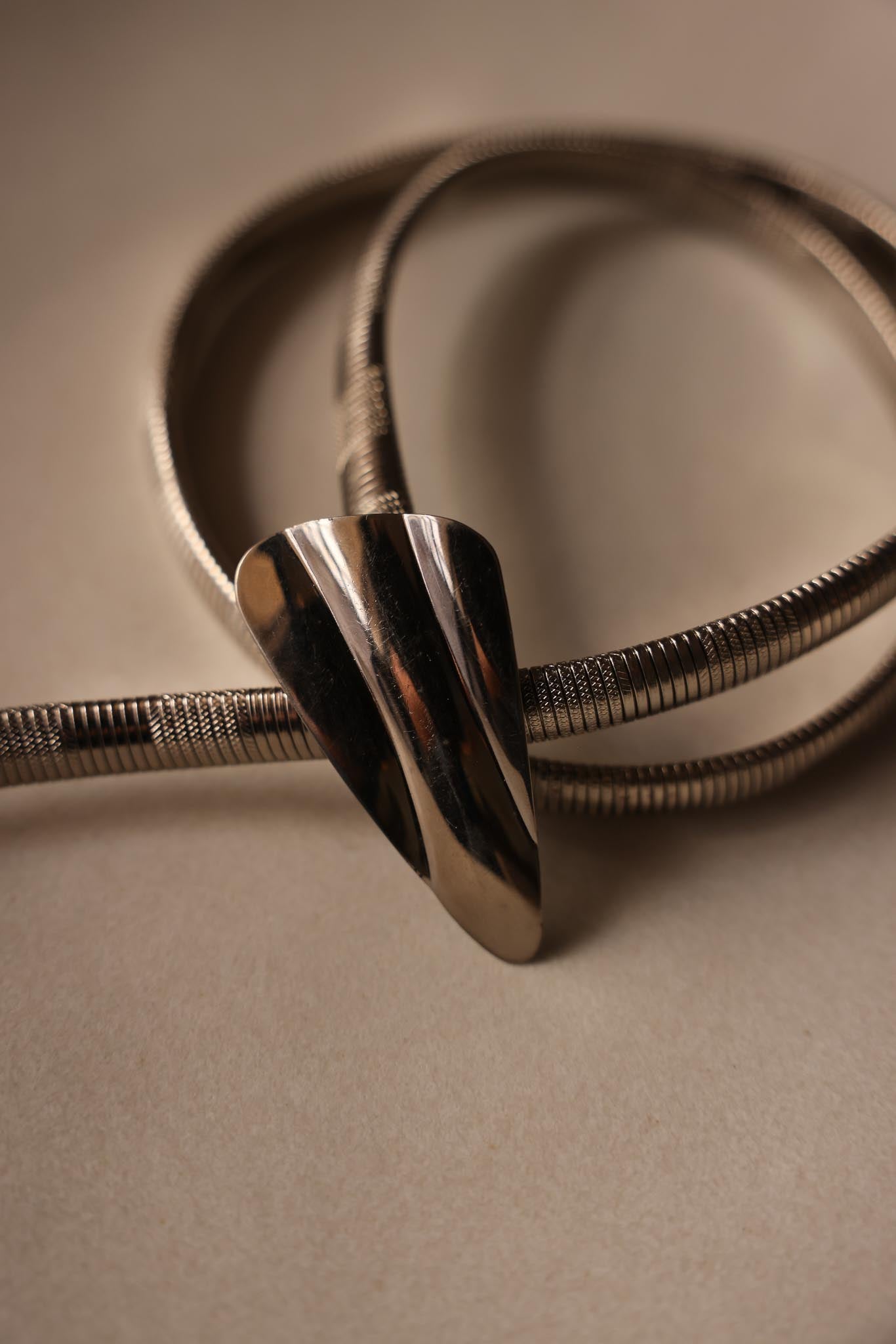 Stretchy Silver-Tone Coil Belt with Sculpted Buckle|Vintage Baazaar 