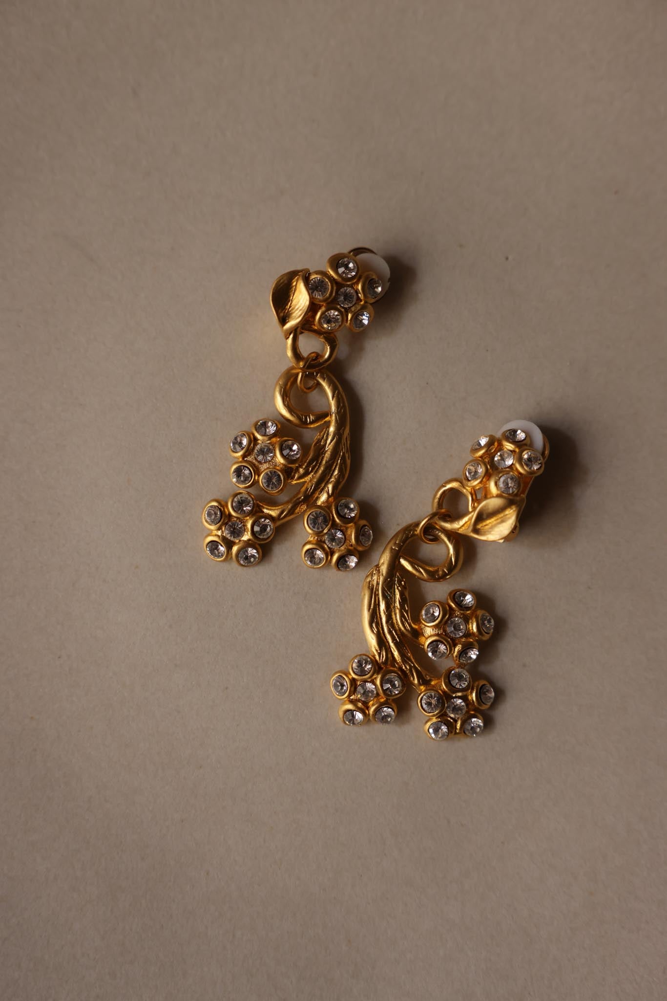 Matte Gold Rhinestone Swirl Clip-On Earrings