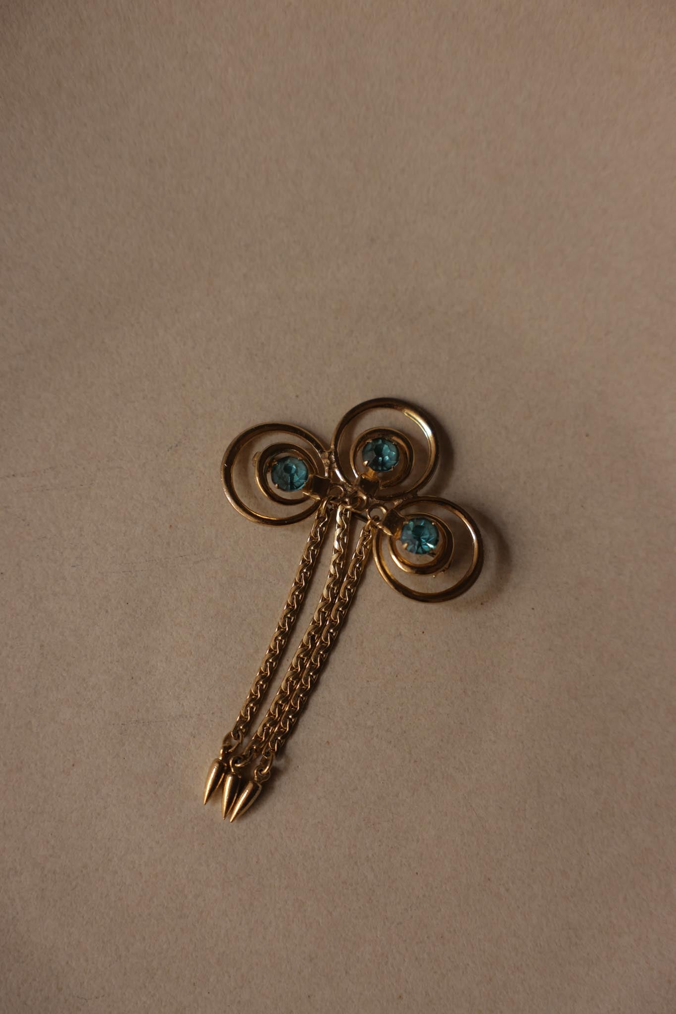 Gold-Tone Swirl Chain Tassel Brooch With Blue Rhinestones|Vintage Baazaar 
