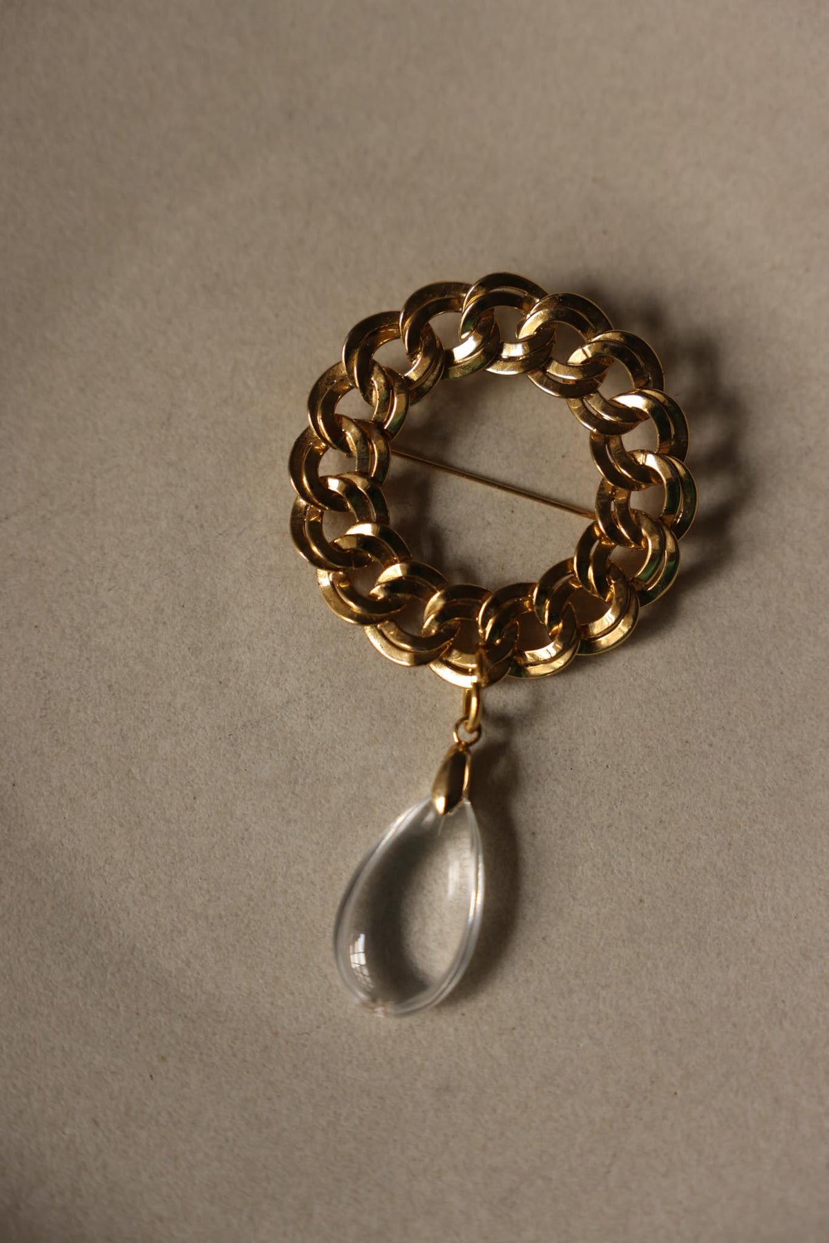 Gold Tone Chunky Chain Link Brooch with Clear Teardrop Dangle