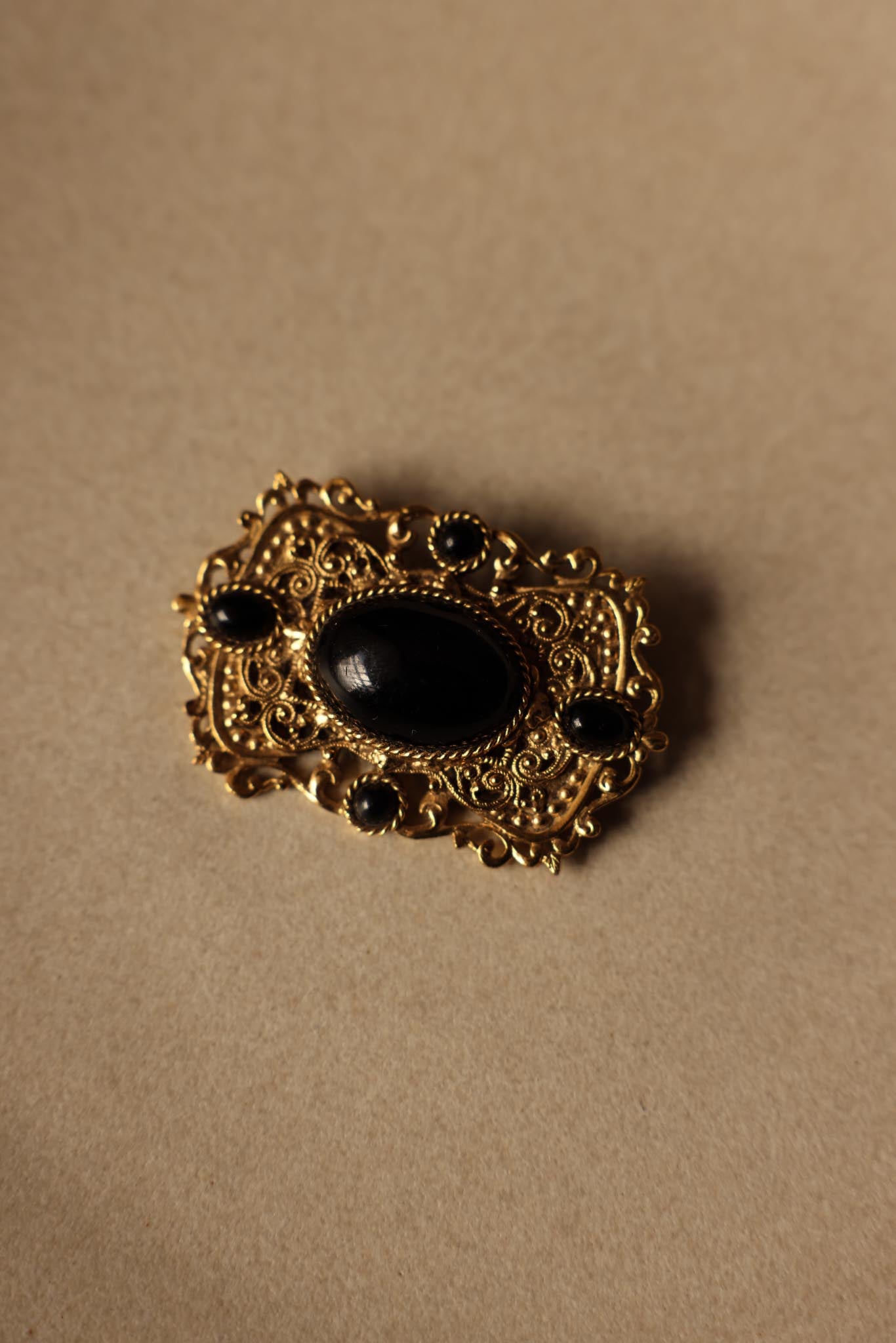 Ornate Gold-Toned Brooch with Black Cabochons|Vintage Baazaar 