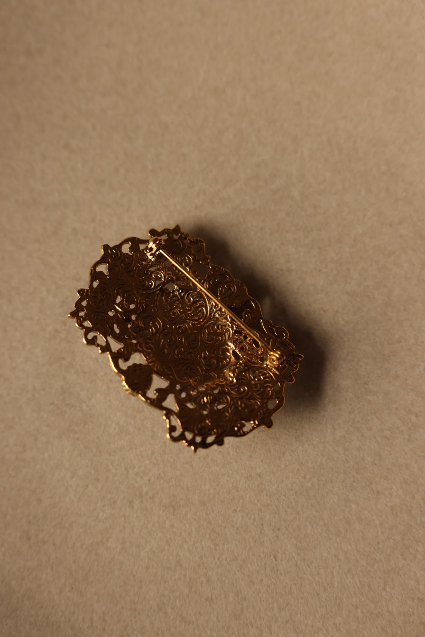 Ornate Gold-Toned Brooch with Black Cabochons|Vintage Baazaar 