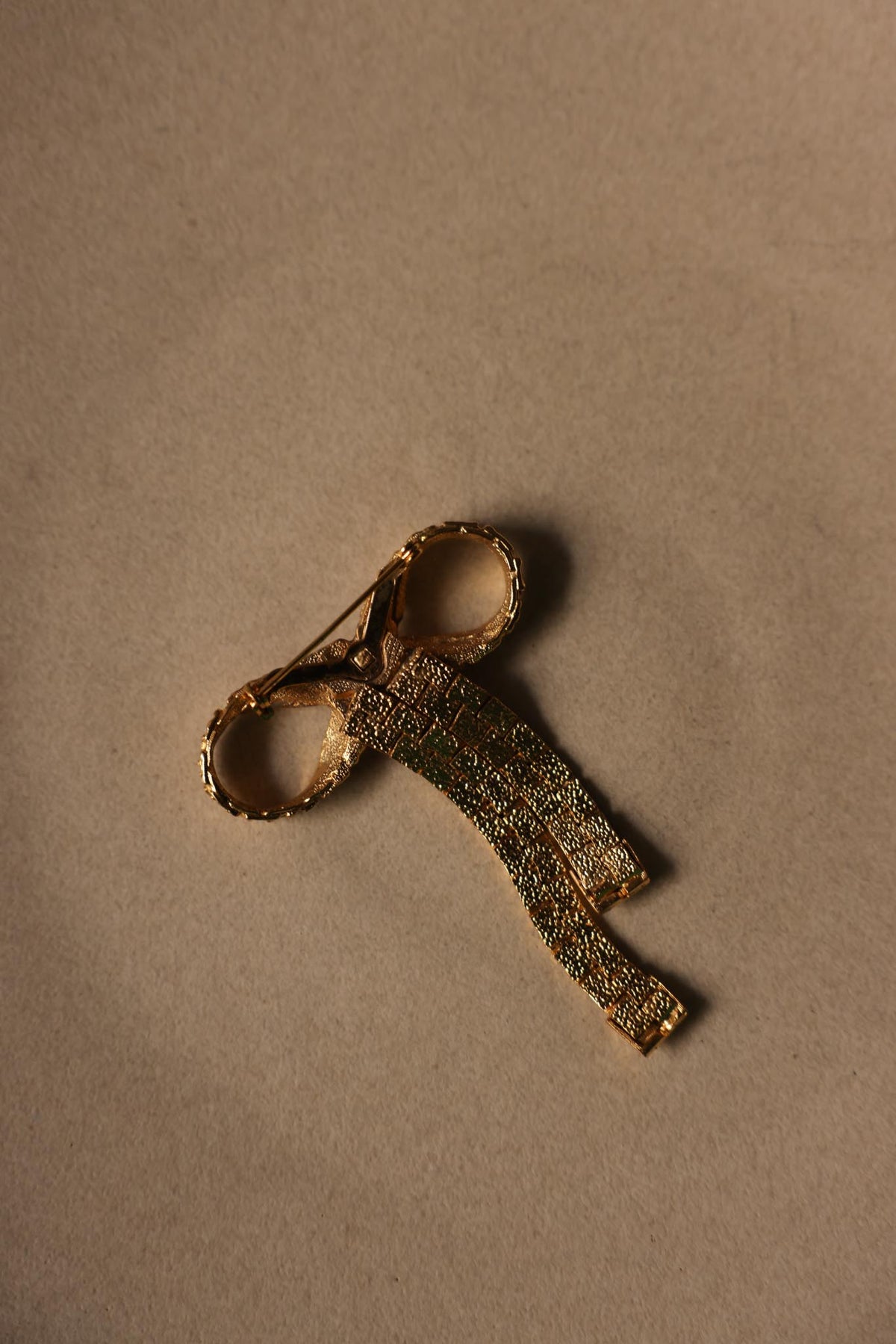 Gold Tone Textured Bow Brooch