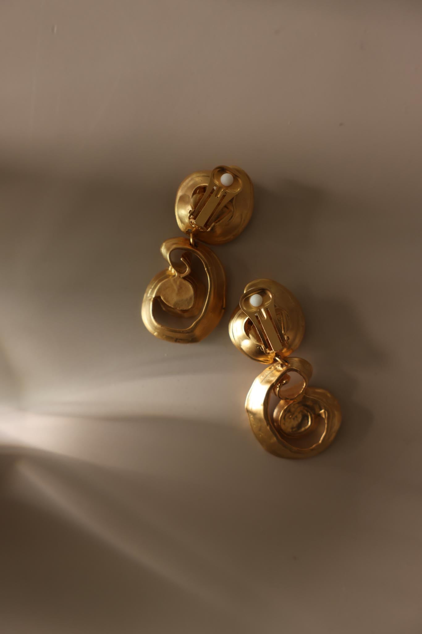 Matte Gold Spiral Rhinestone Drop Clip-On Earrings