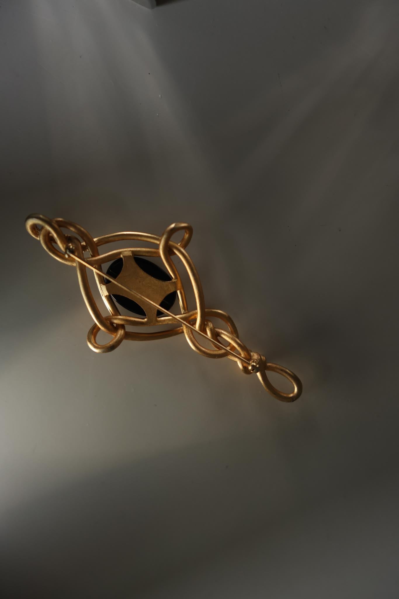 Gold-Plated Brooch with Black Glass Center