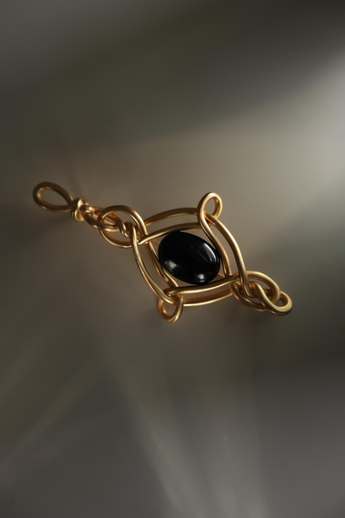 Gold-Plated Brooch with Black Glass Center