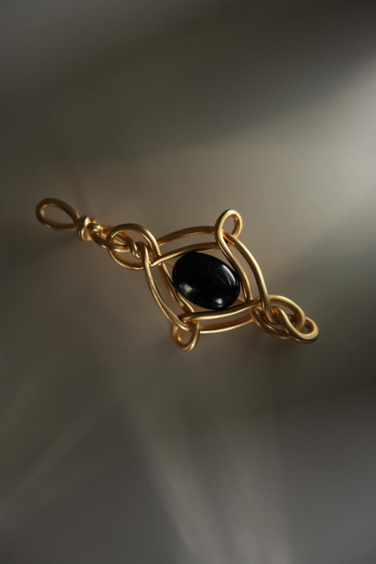 Gold-Plated Brooch with Black Glass Center