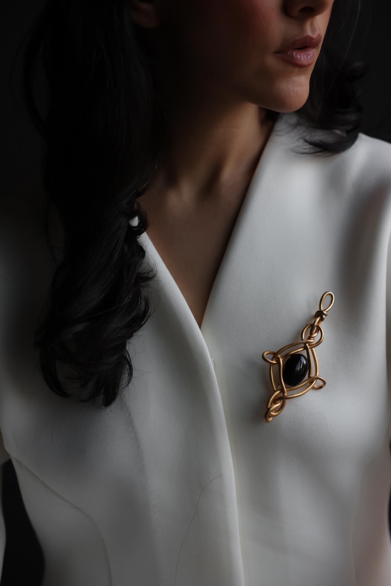 Gold-Plated Brooch with Black Glass Center