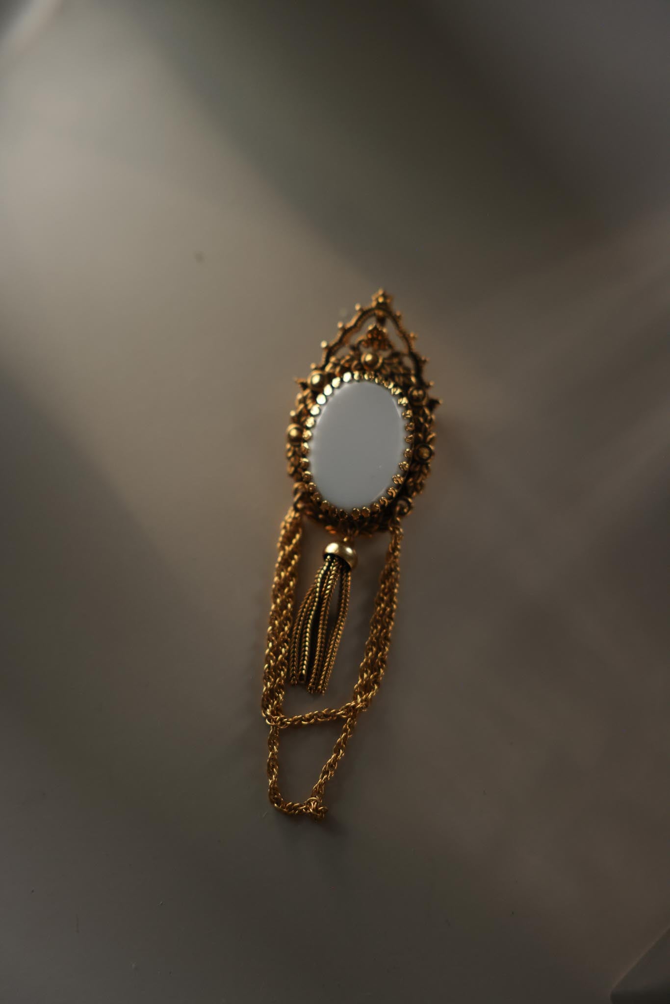 Gold Tone White Glass Pendant Brooch with Chain Tassel